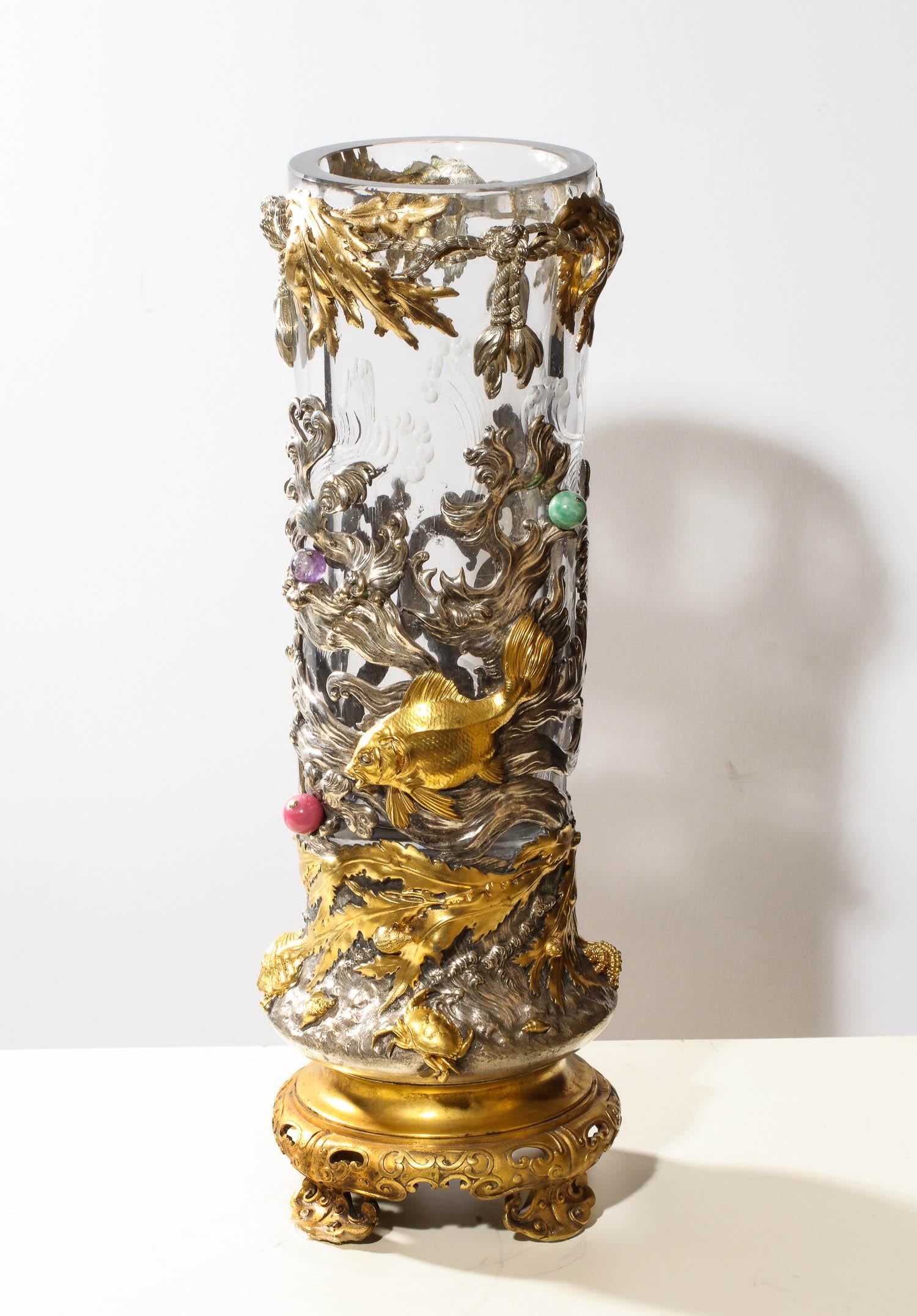 A rare French Japonisme ormolu and silvered bronze cut glass vase by L'Escalier De Cristal, Paris, circa 1870.  Provenance: The Strong Museum, Rochester, New York 

Profusely decorated with flying fish, langoustines, and seaweed on a pierced Stand,