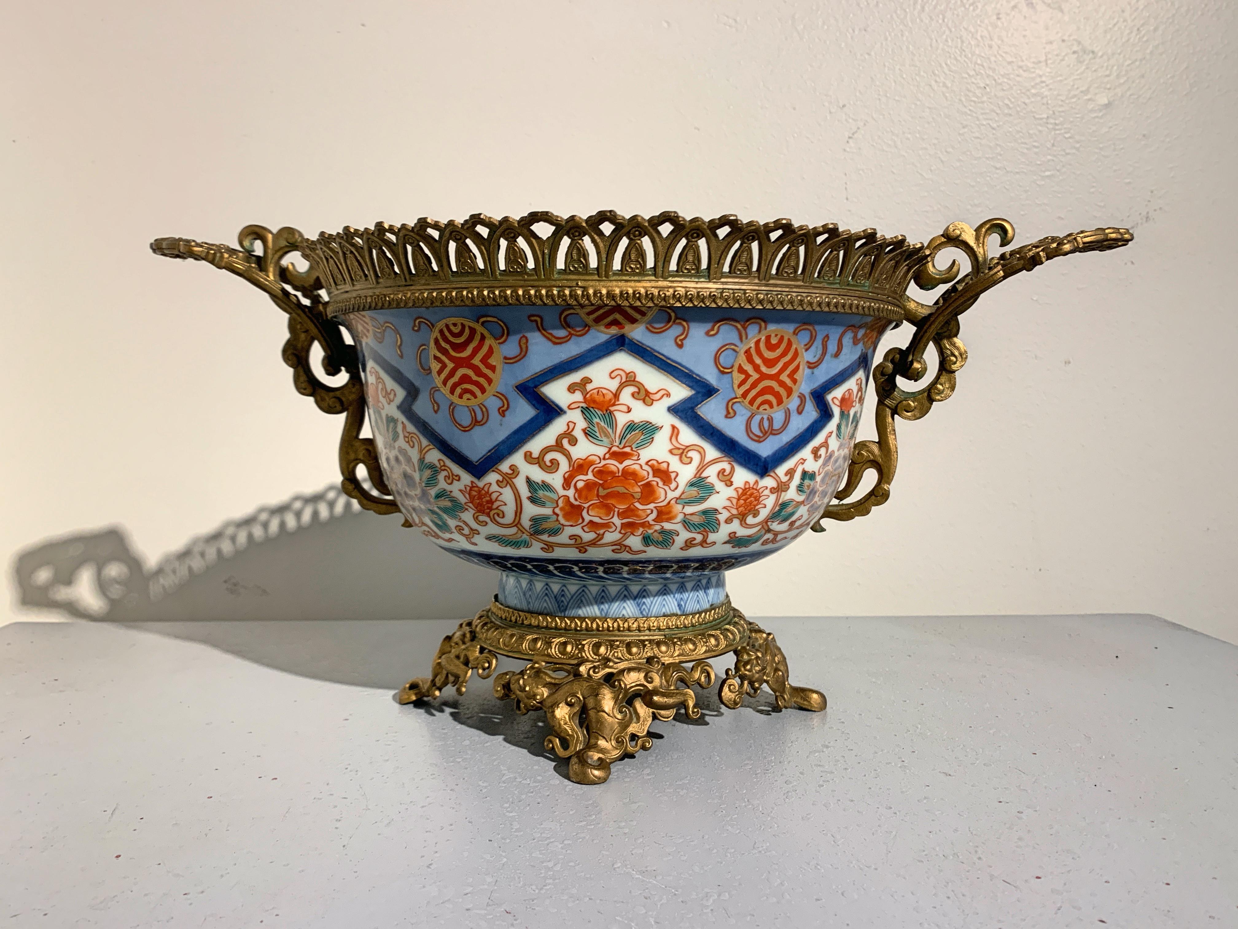 An elegant French Louis XVI style Japonisme centerpiece comprised of a large 19th century Meiji Period Japanese Imari Porcelain bowl with French gilt metal ormolu mounts, late 19th-early 20th century, France and Japan. 

The 19th century Meiji