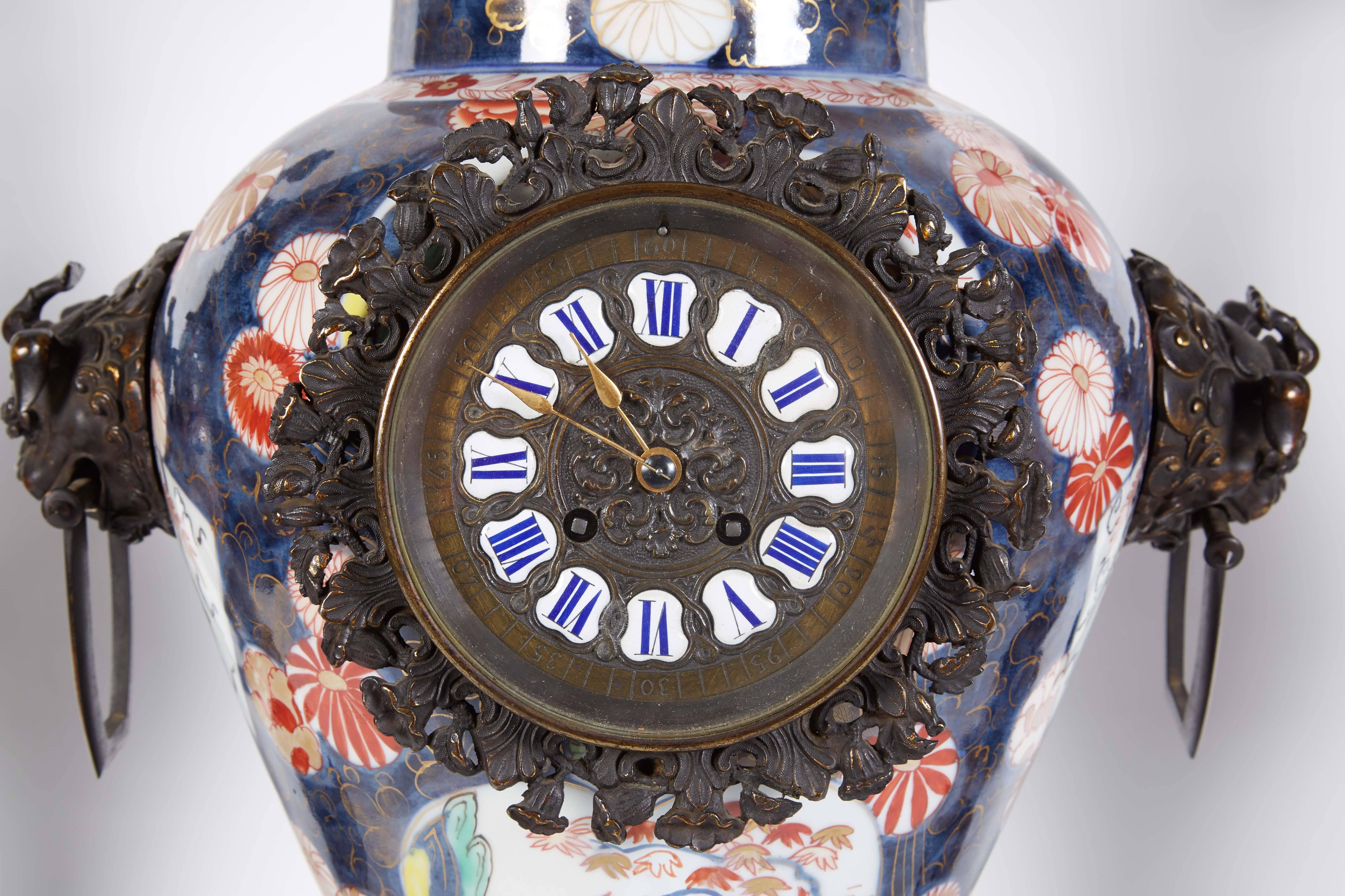 A French Japonisme parcel-gilt patinated bronze and Japanese Imari Porcelain clock garniture, circa 1880. In the manner of Edouard Lievre.

Mounted with bronze dragons and elephant heads, very finely made.

The clockworks stamped H. Sequin,