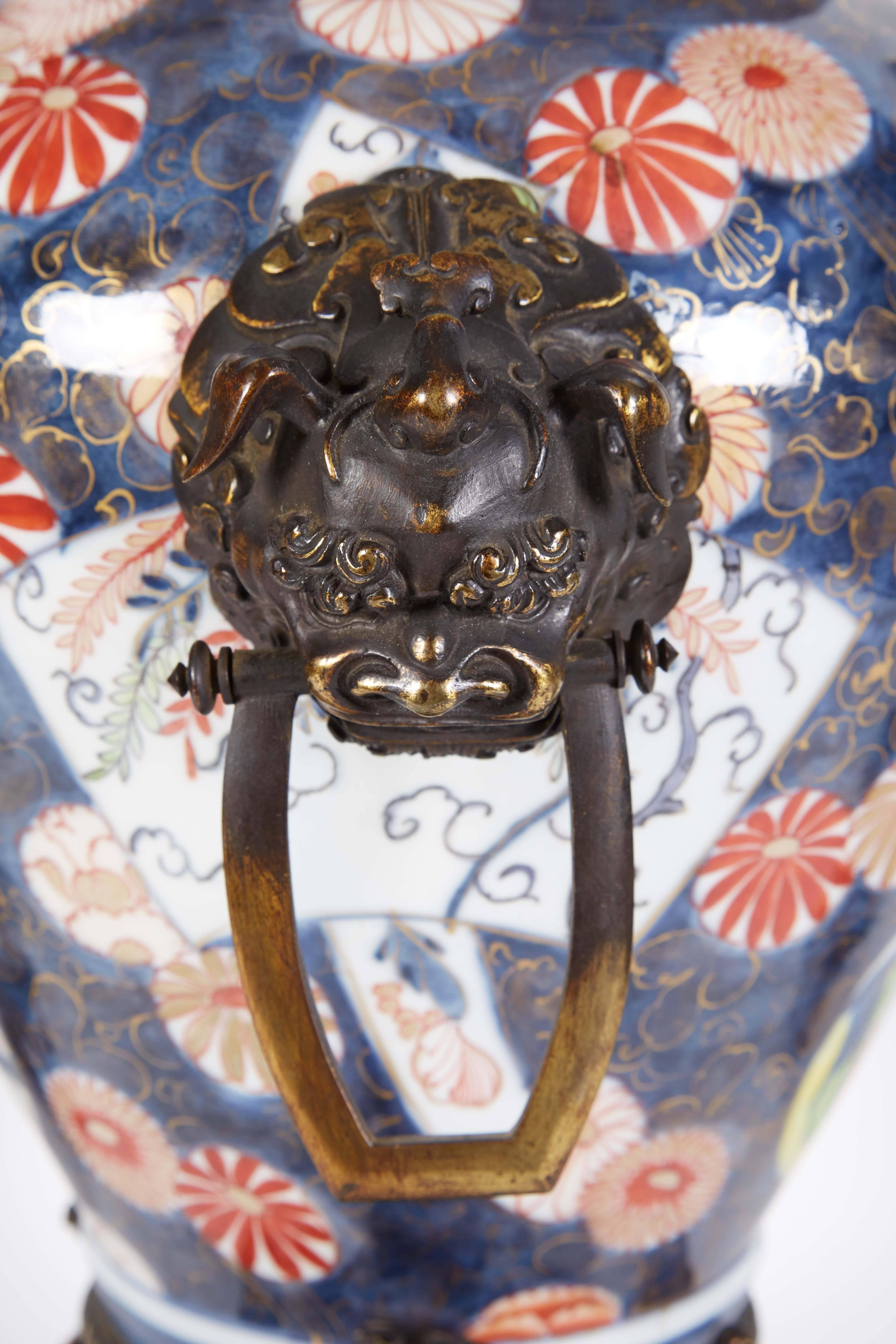French Japonisme Parcel-Gilt Patinated Bronze Imari Porcelain Clock Garniture 1