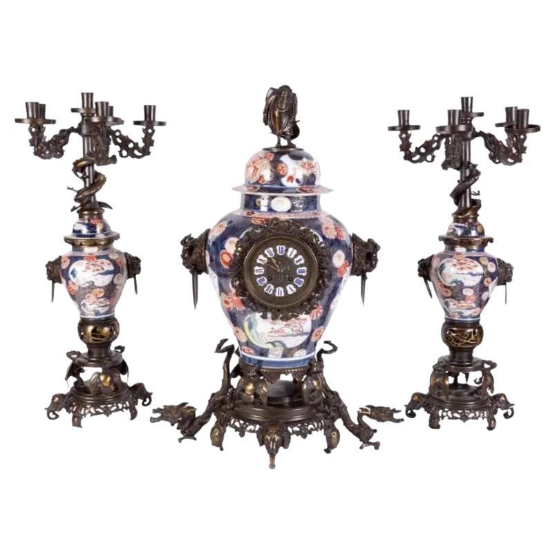 French Japonisme Parcel-Gilt Patinated Bronze Imari Porcelain Clock Garniture For Sale