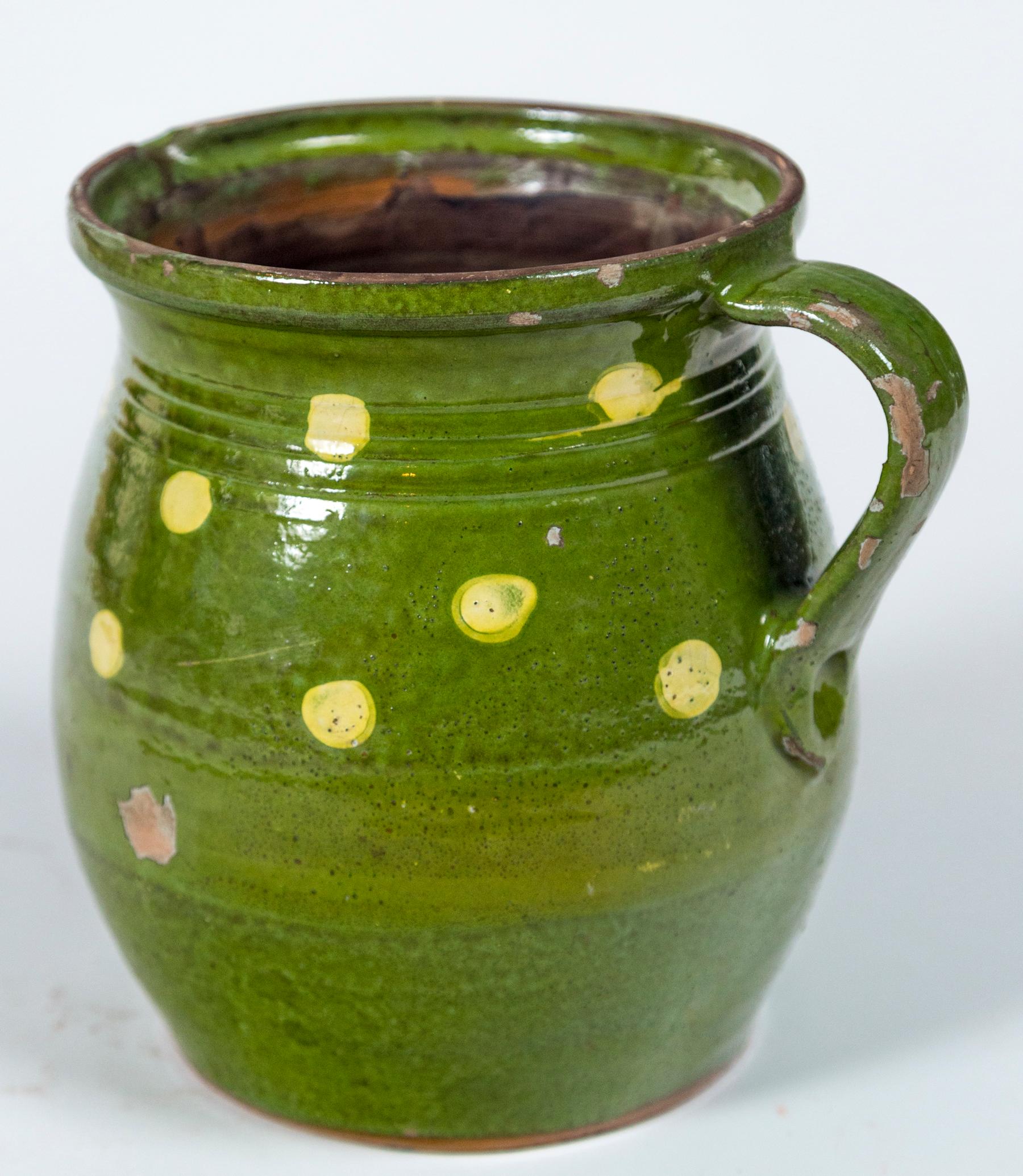French Jaspé ware dotted pitcher, early 20th Century. Large, bright green glazed pitcher with pale yellow dots.
