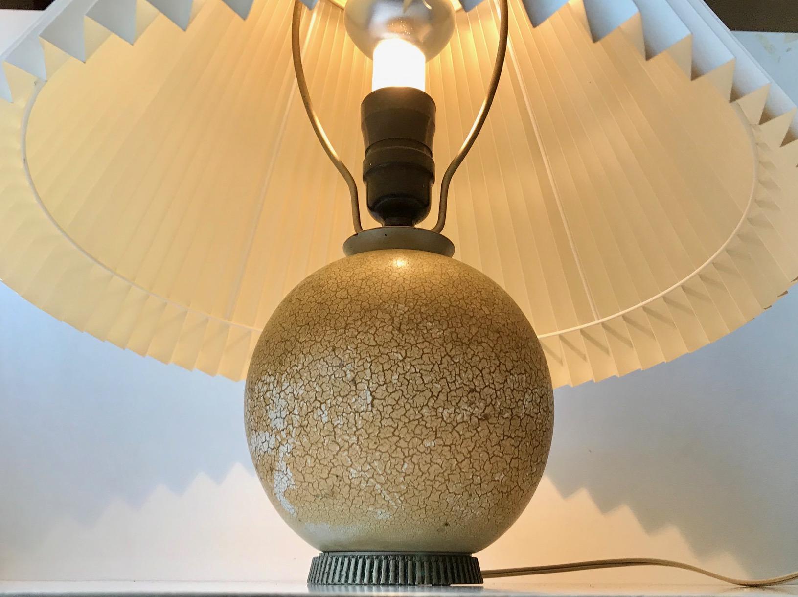 Playfully glazed spherical wooden table light in the style of Jean Besnard. Designed and created by anonymous designer/maker in France during the 1920s or 1930s. No markings or signature to the base. This light is sold without a shade as they were
