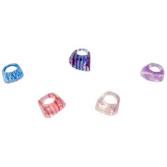 Vintage French jewelry artist. Five designer rings in plastic. Striped design.