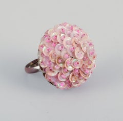French jewelry artist. Four designer rings in metal and plastic. Flower designs.
