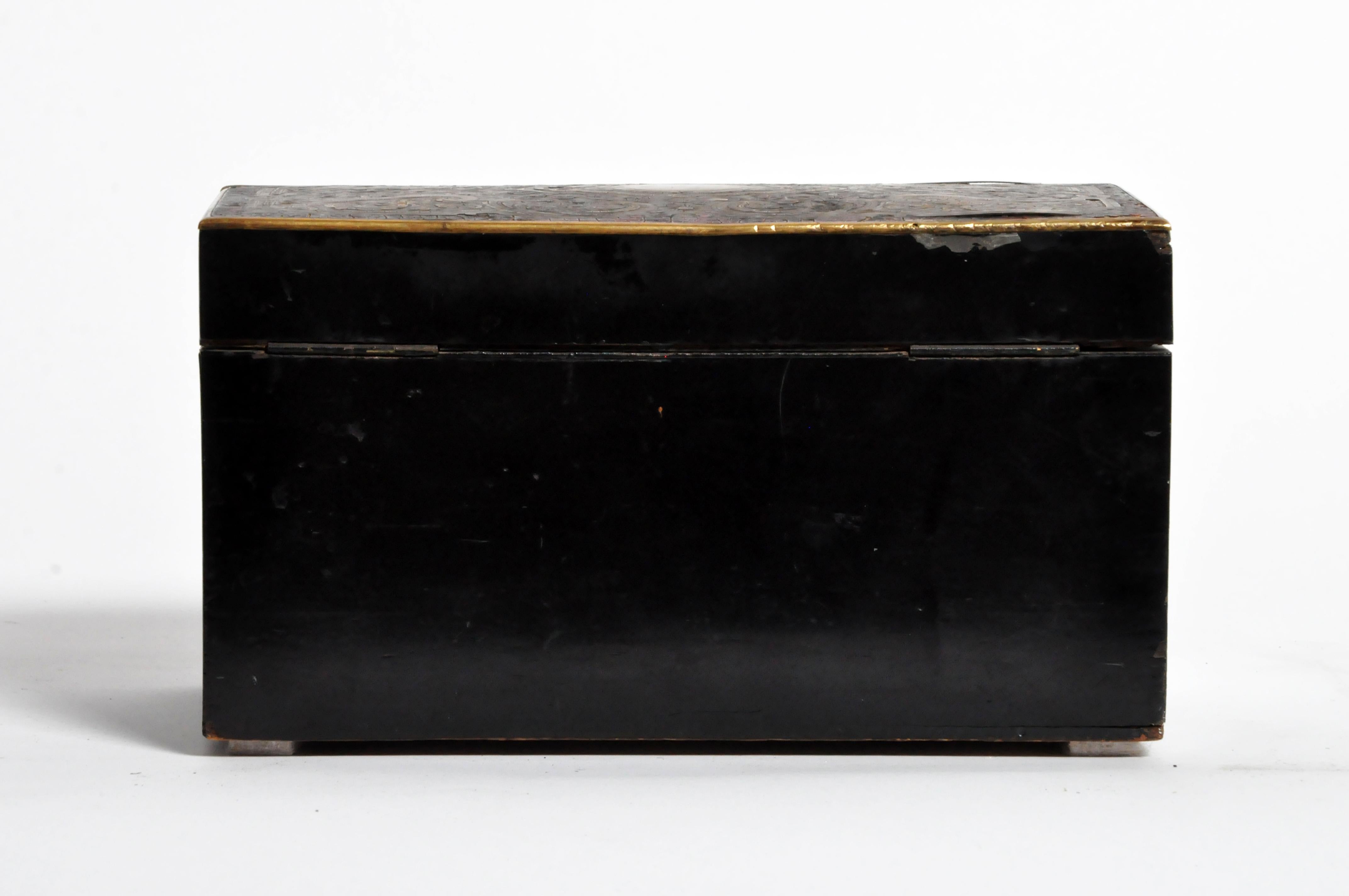 This finely made box features a polished lacquer surface, brass fittings, and two interior compartments. Made circa 1900, wear is consistent with age and use.
 