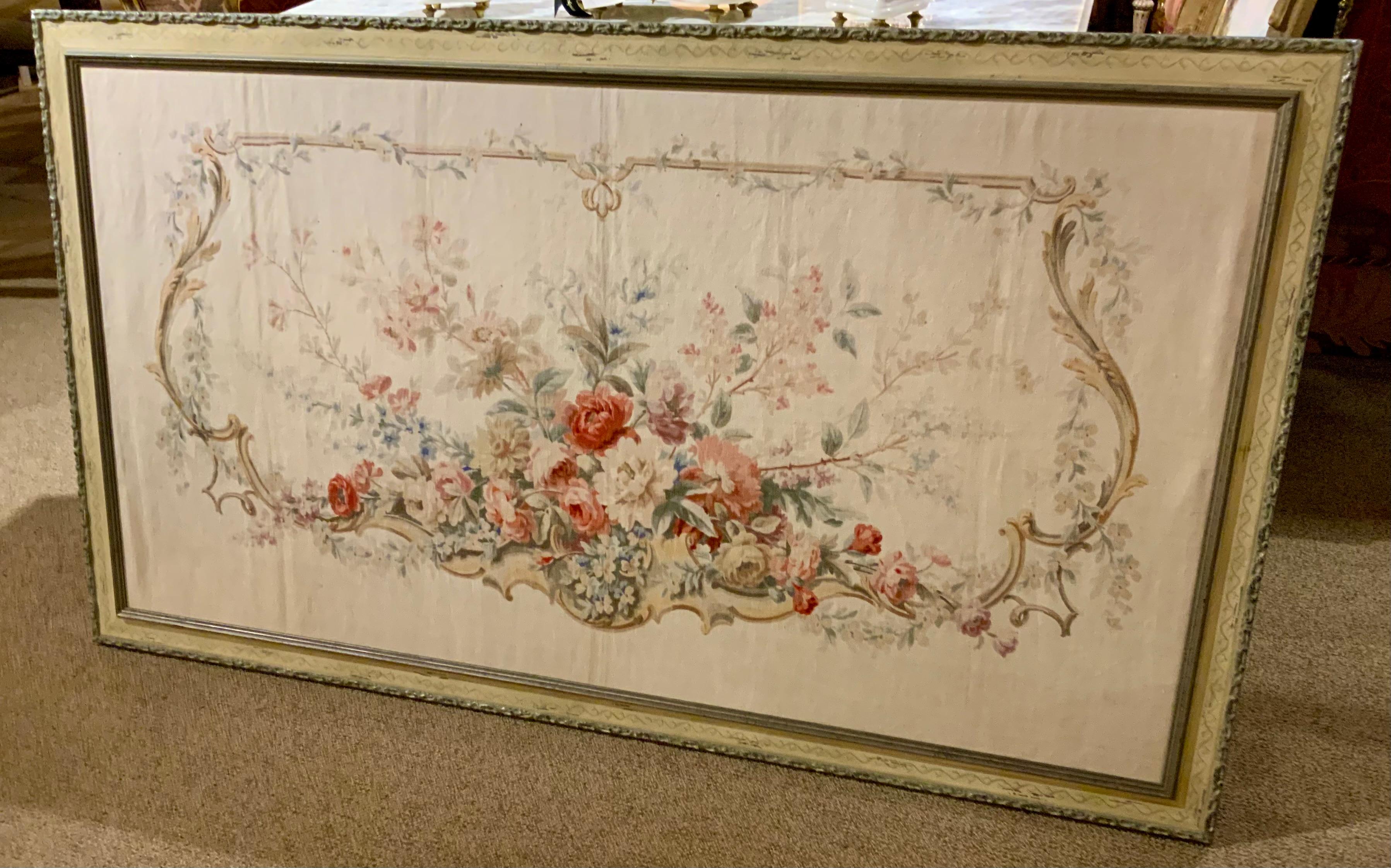 This tapestry is hand painted with a floral array of roses and
Flowers. It is painted on a linen type fabric. The frame is
Well done and hand painted in pale cream color with
A silver edge. Well painted and executed in a traditional 
Fashion. No