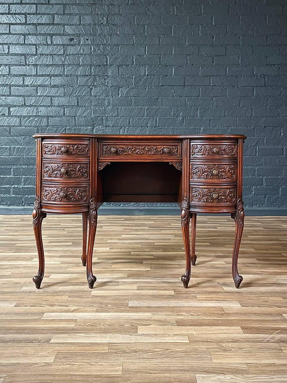 Condition: Original Vintage Condition

Materials: Walnut, Carved Wood Pulls
Style: French Antique

A masterpiece of French style craftsmanship, this vintage kidney-shaped desk exudes elegance and sophistication. Crafted from rich walnut, it boasts
