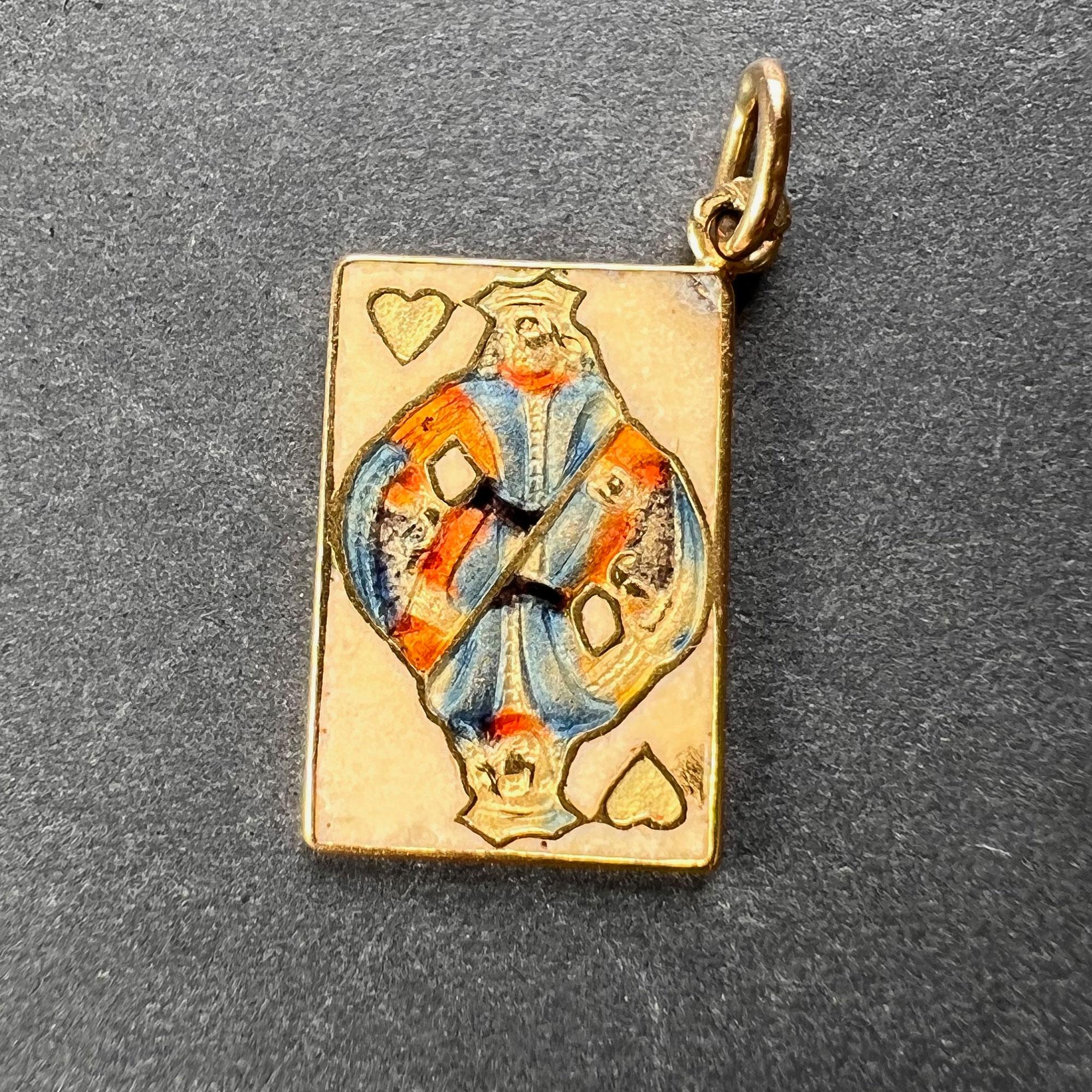An 18 karat (18K) yellow gold and enamel charm pendant designed as the King of Hearts playing card. Stamped with the eagle mark for 18 karat gold and French manufacture.
 
Dimensions: 1.7 x 1 x 0.1 cm (not including jump ring)
Weight: 1.90 grams