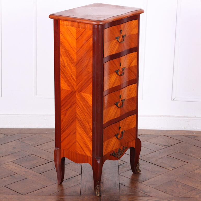 Tall and narrow French Louis XV style four-drawer chest or commode with book-matched kingwood veneered drawers.
  