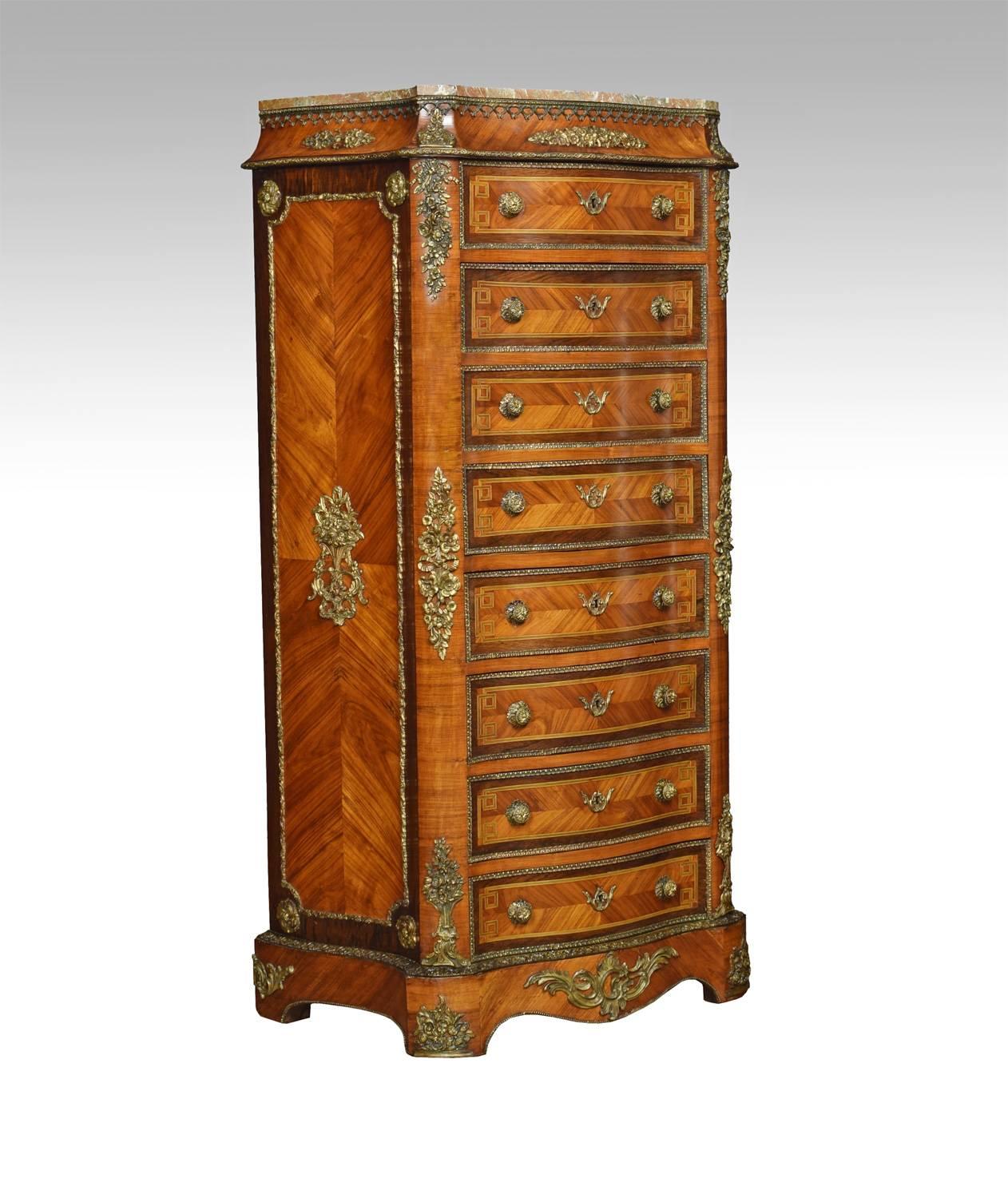 French kingwood secretaire a’ abbattant, in the Louis XVI taste, the vined marble top, above conforming serpentine front with a single short draw over a fall front secretaire, enclosing drawers and shelf with blue tooled leather writing surface,