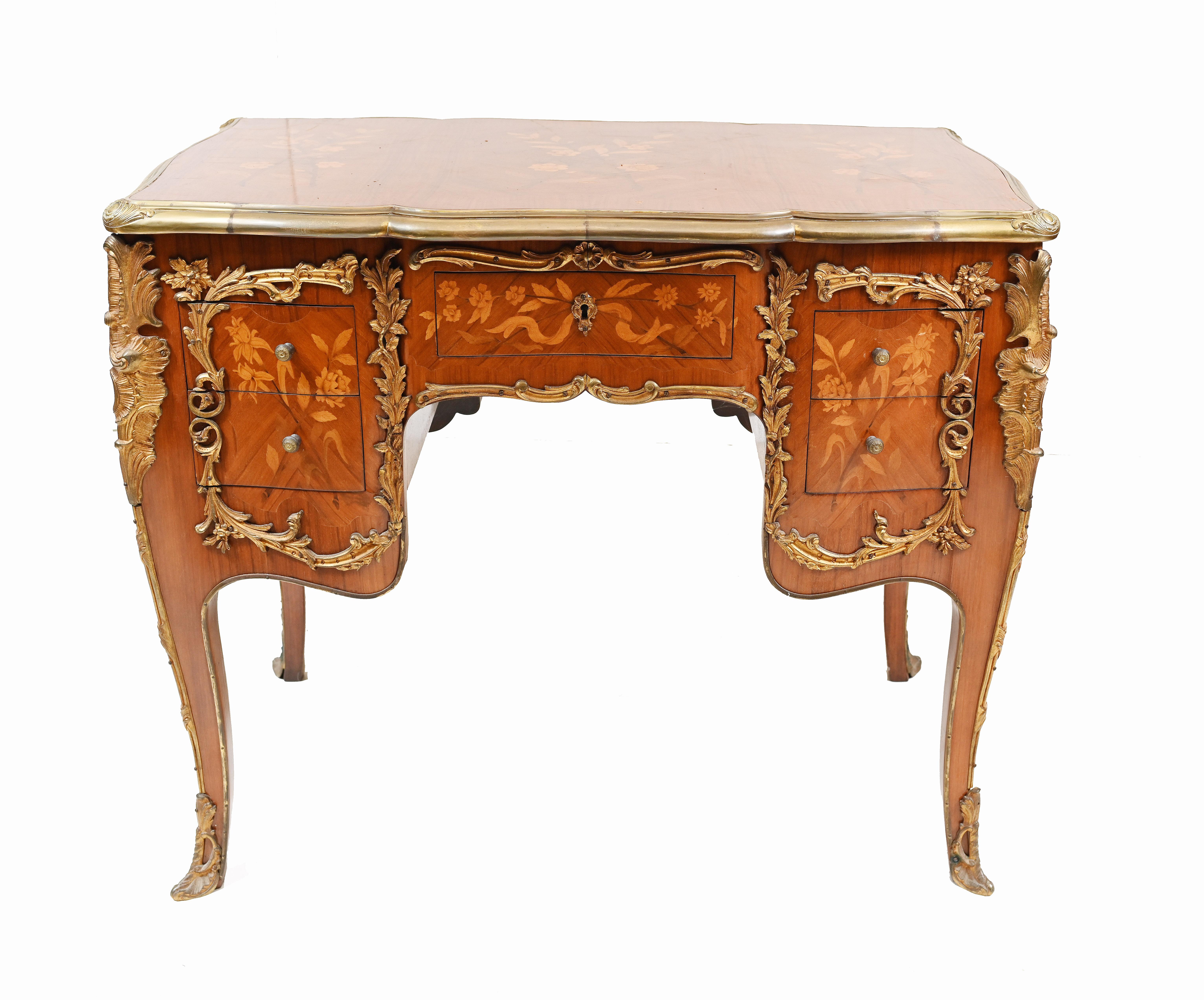 Very cute French knee hole desk in the Empire manner.
Antique desk we date to circa 1930.
Features intricate marquetry inlay work showing floral motifs.
Ormolu fixtures also original.
Bought from a dealer on Marche Biron at Paris antiques