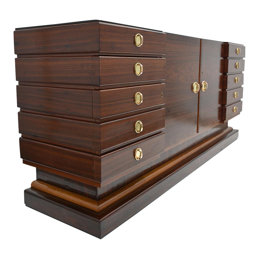 This French Art Deco buffet features a sleek design and is made out of a maple and rosewood combination stained in mahogany color with a lacquered finish. The buffet comes with four drawers and four doors and a spacious center cabinet with a