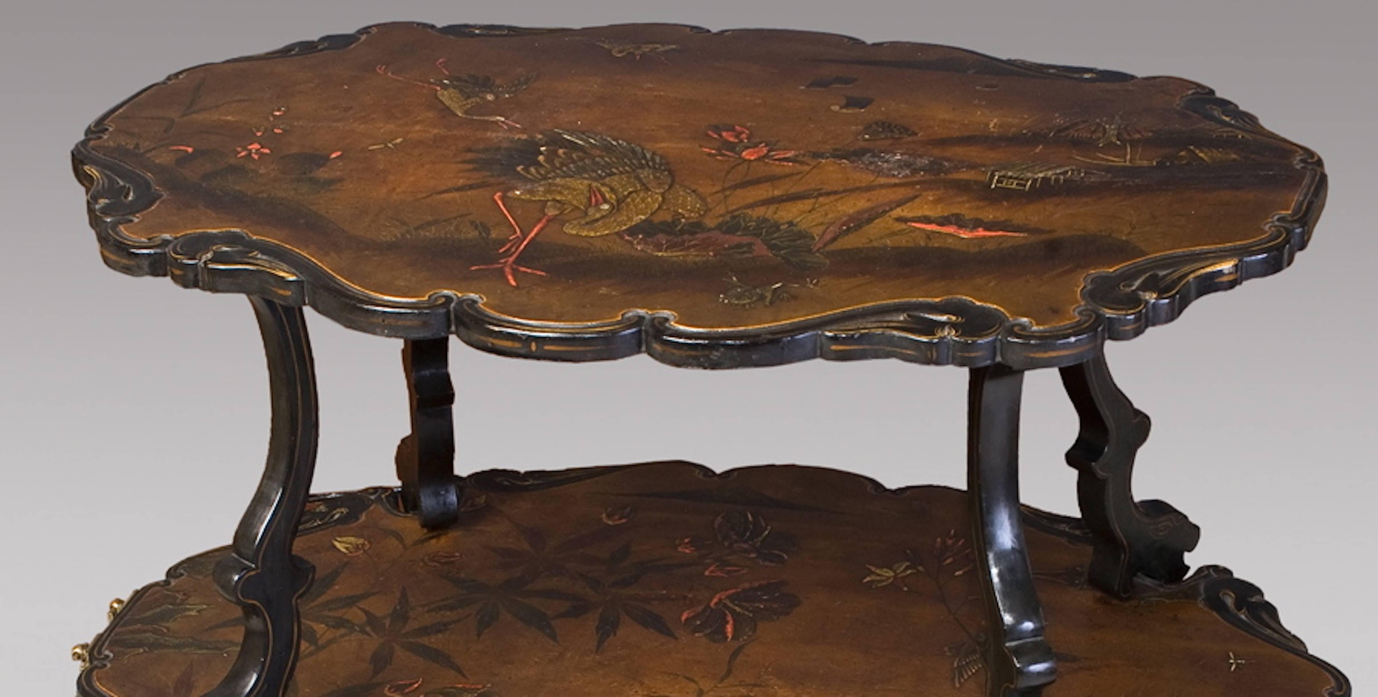 French lacquered two-tier table
circa 1880
With birds in a landscape decoration.

  
