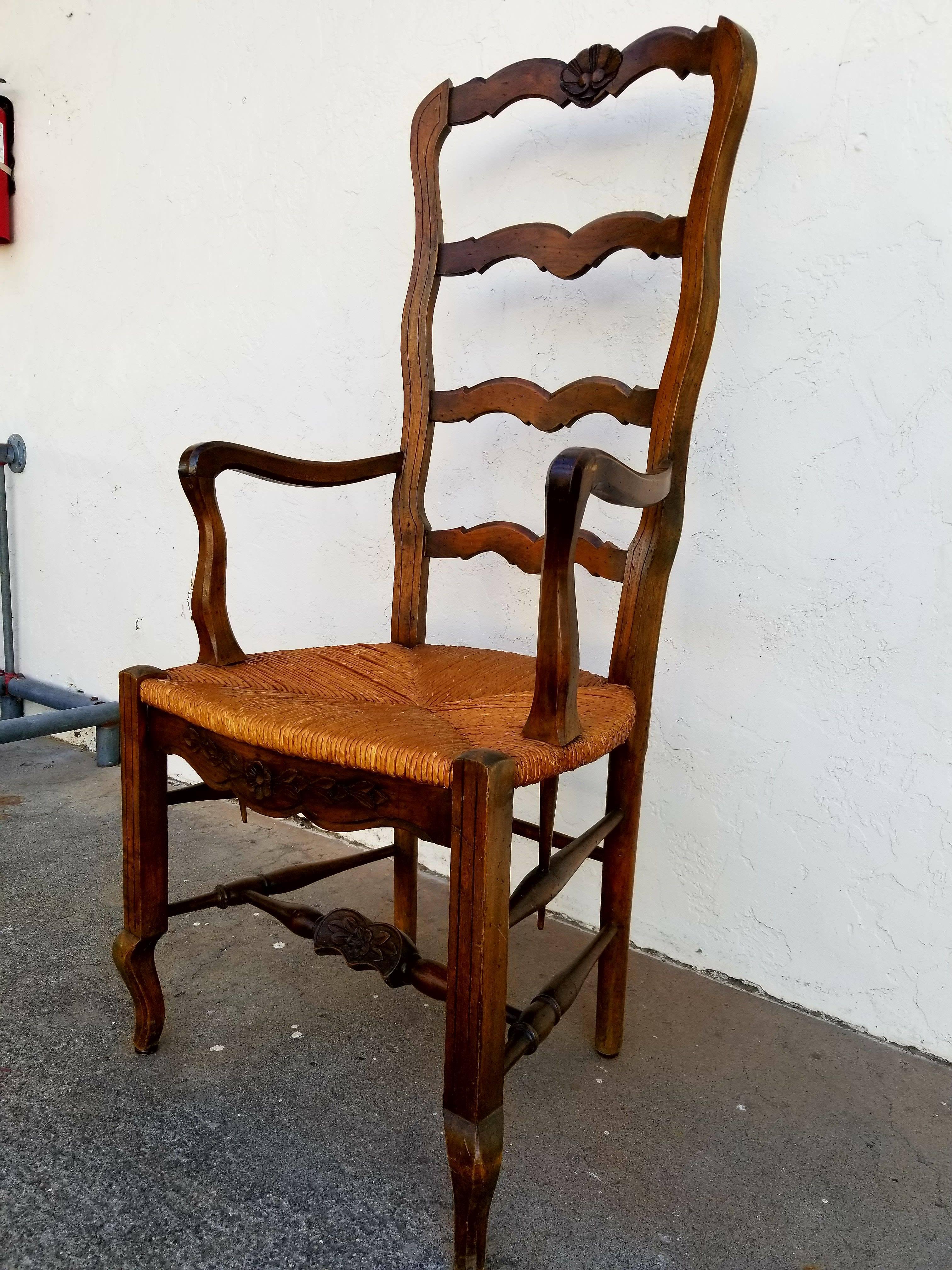 A set of eight Country French ladder back dining chairs with rush seats. High back chairs measuring 47