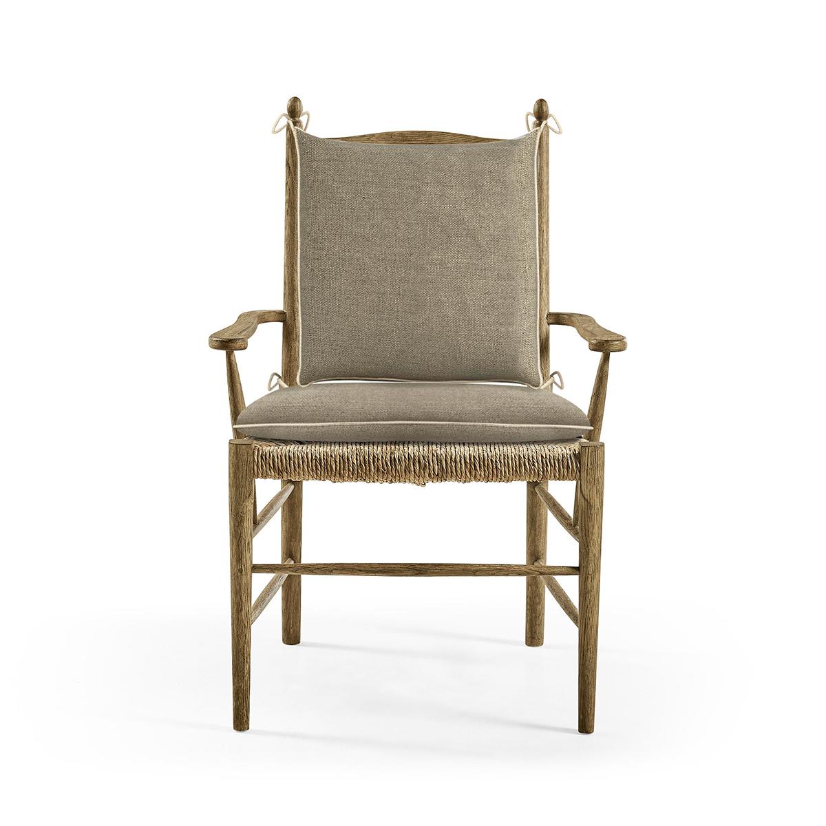 This chair boasts a robust stripped chestnut finish to the frame that reveals the exquisite natural grain and charm of the wood, evoking a sense of traditional beauty. Wrapped in creamy oatmeal performance fabric cushions, the chair combines plush