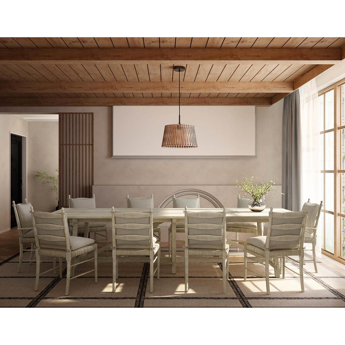 This chair boasts a robust oatmeal stripped oak finish to the frame that reveals the exquisite natural grain and charm of the wood, evoking a sense of traditional beauty. Wrapped in creamy oatmeal performance fabric cushions, the chair combines