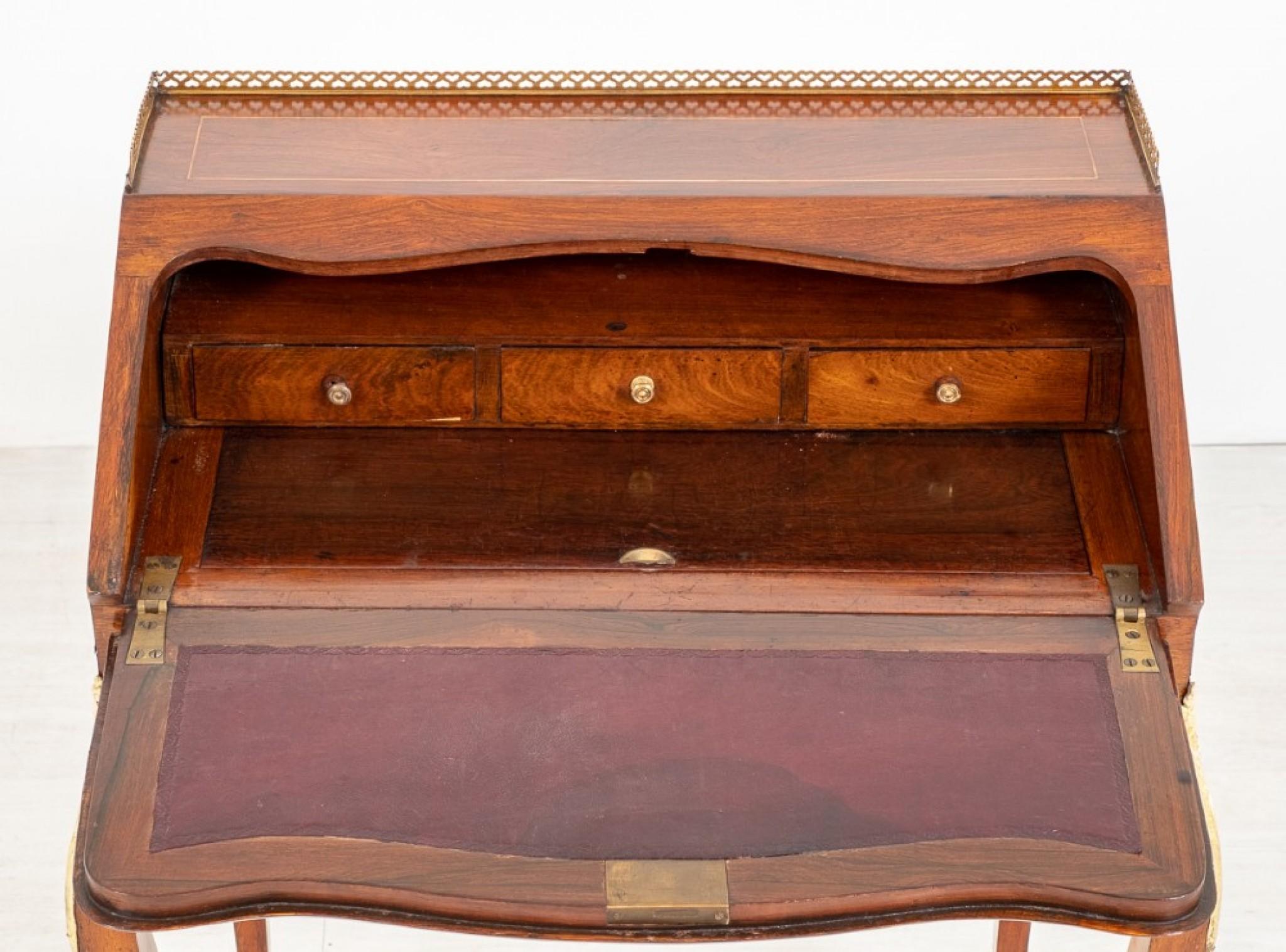 Pretty French Walnut Ladies Bureau.
circa 1860
Standing Upon Swept Legs with Ormolu Mounts to the Toes and Knees.
The Fall Having Floral Marquetry Decoration and Opens to Reveal 3 Interior Drawers, A Sliding Well and a Leather Writing Surface to