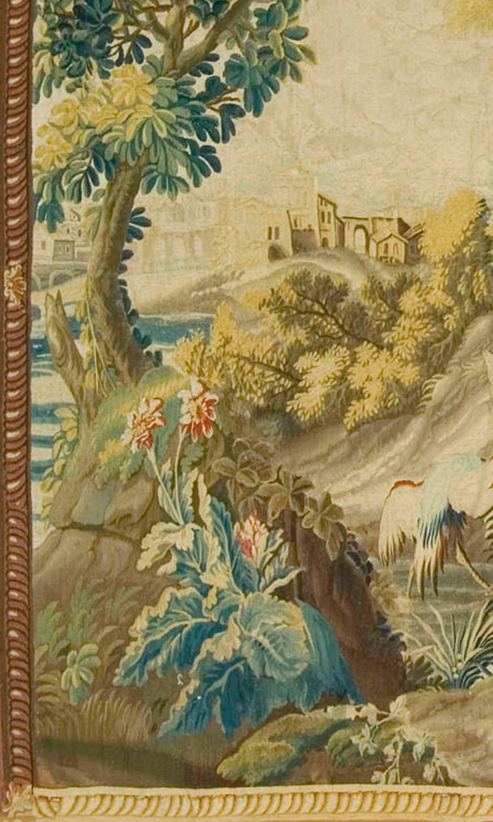 French landscape tapestry probably Beauvais, circa 1750. Although not a product of the Royal Gobelins factory in Paris, this pictorial landscape tapestry is extremely Fine with silk highlights. The French royal tapestry works in the Gobelins made