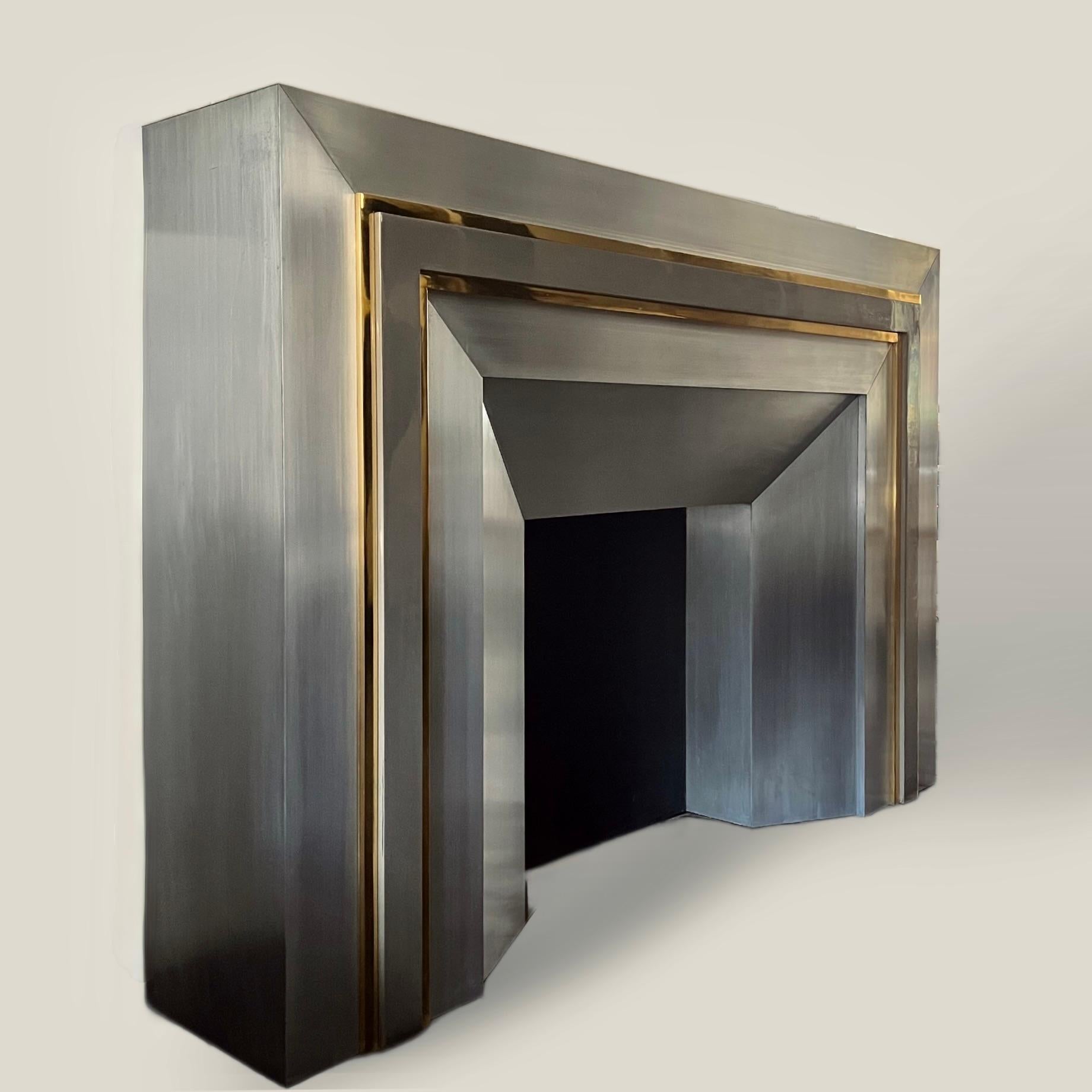 A stunning large French streel and brass fire surround by Maison Jansen, with fabulous brass lines, solidly made and backed onto a substantial wood frame.