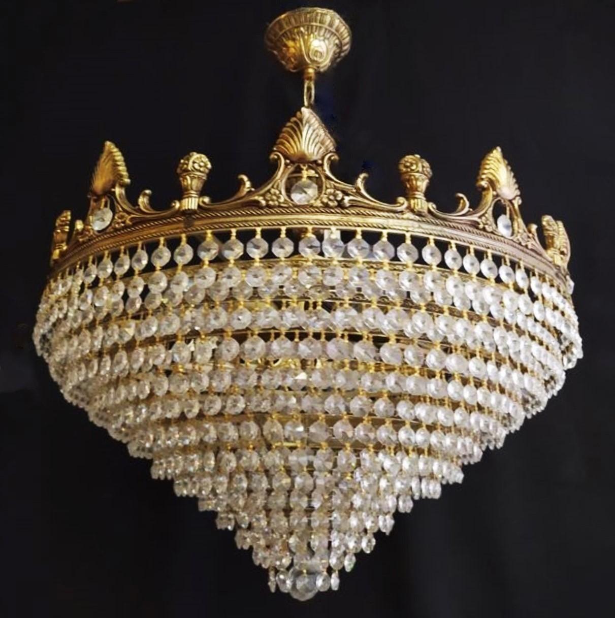 A large, beautiful Art Deco period crystal 5-light chandelier or flush mount, France, 1930s. Decorative bronze frame with twelve crystal tiers with crystal sphere at the bottom. This chandeleier can also be used as flush mount by removing the chain
