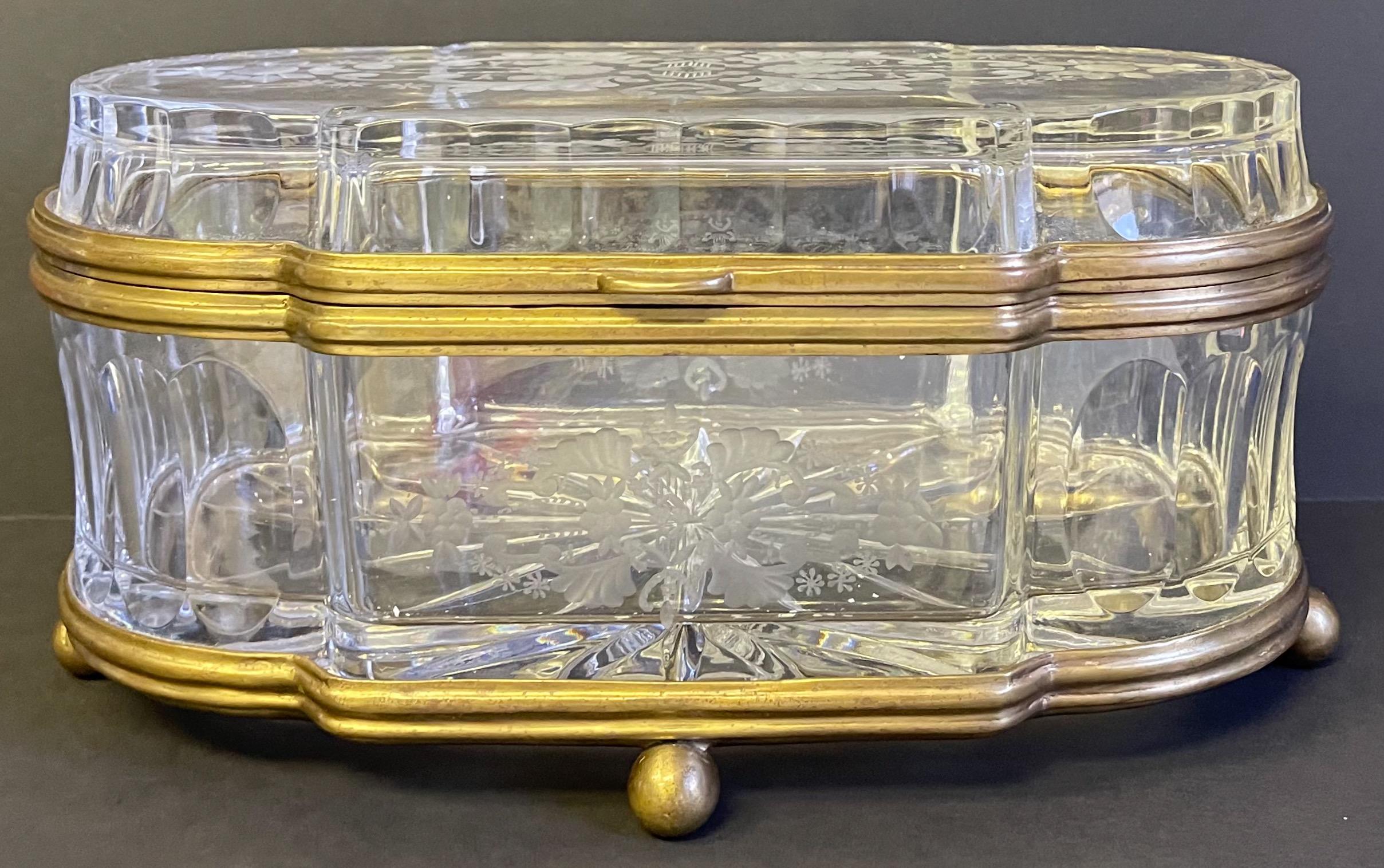 This is a good looking large scale French cut glass and brass lozenge shape box or casket in very good condition. I am estimating it dates to the middle of the 20th century.