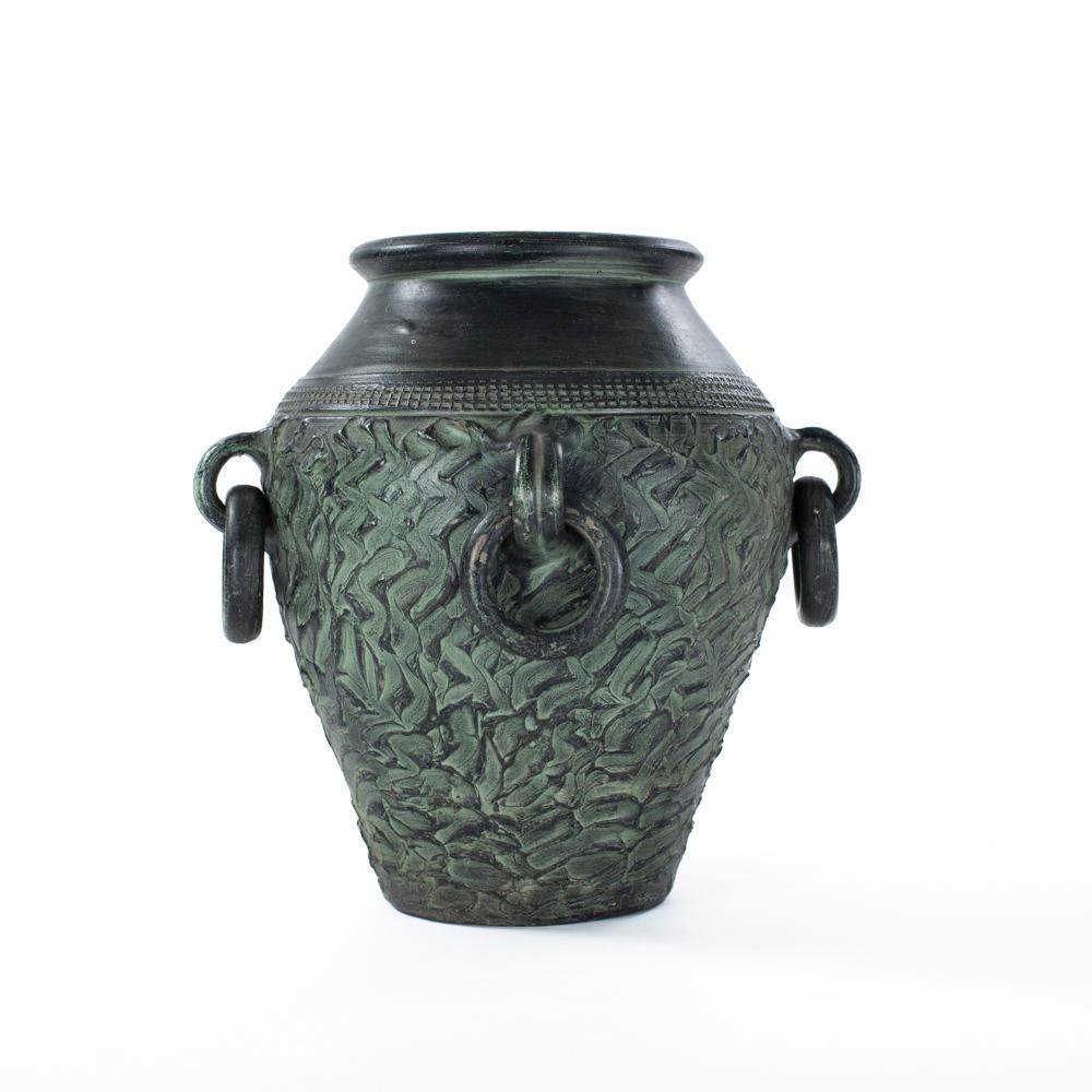 Fantastic, large vintage ceramic in a rich pine green with light and darker parts from the middle of the last century.
The vase has an elegant shape, the outer wall of the upper part with the rounded neck (opening is 18cm) is smooth and the green is
