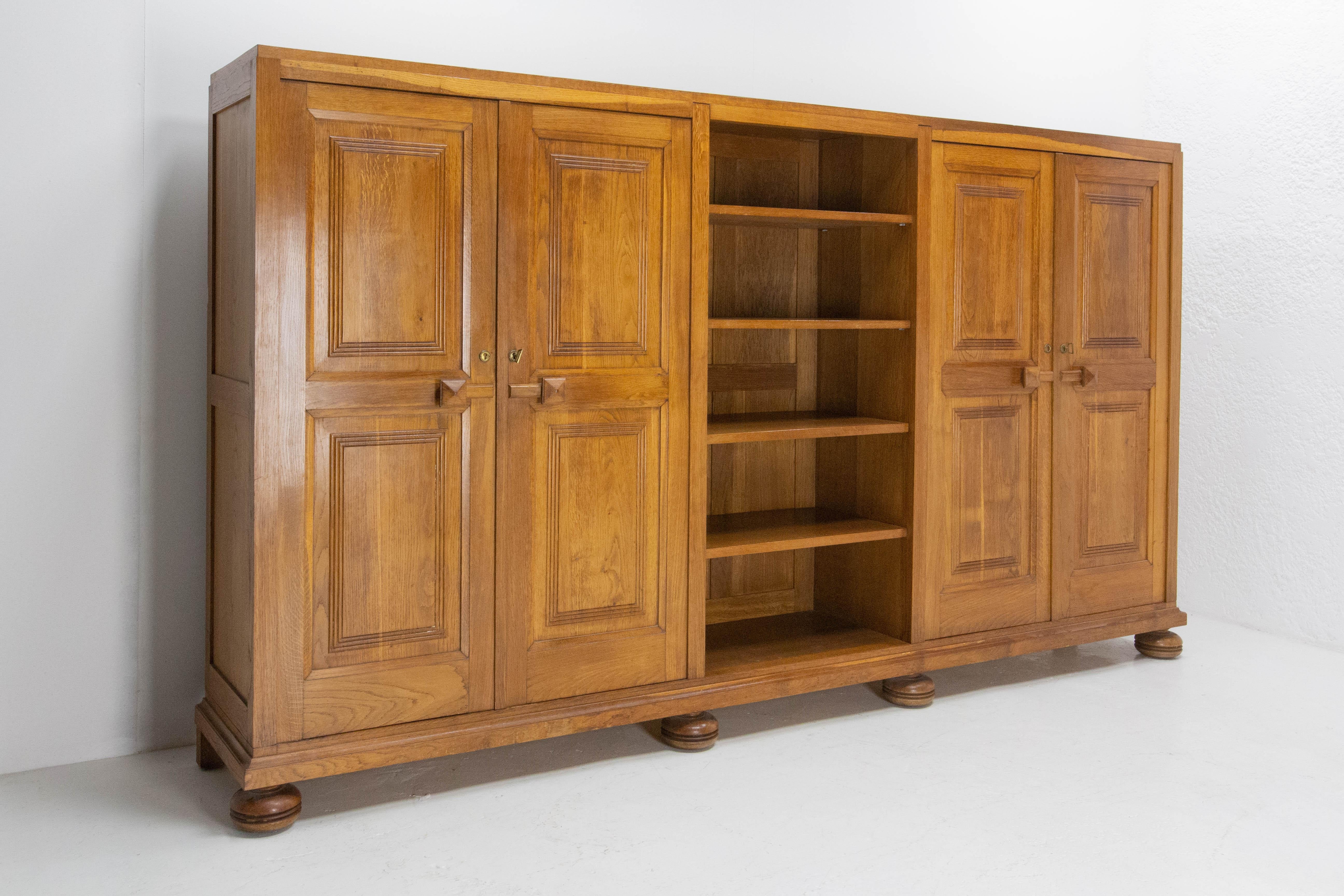 French oak armoire in three parts : wardrobe, book case and shelves, mid-century
Good condition.

Shipping:
2 packs: 
Pack 1: 309/50/63 cm 192 kg.
Pack 2: 107/8/151 cm 41.2 kg.
 