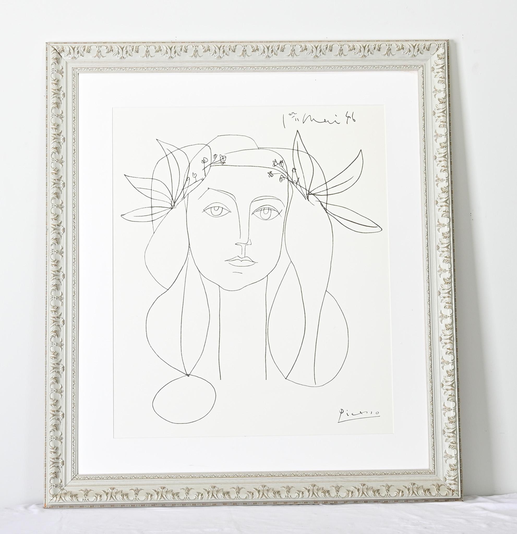 A free-spirited line drawing/portrait by Pablo Picasso of artist Françoise Gilot, this work is a more recent reproduction of the famous 1946 original made early in their relationship. Framed and matted without glass in chalky blue & gold resin