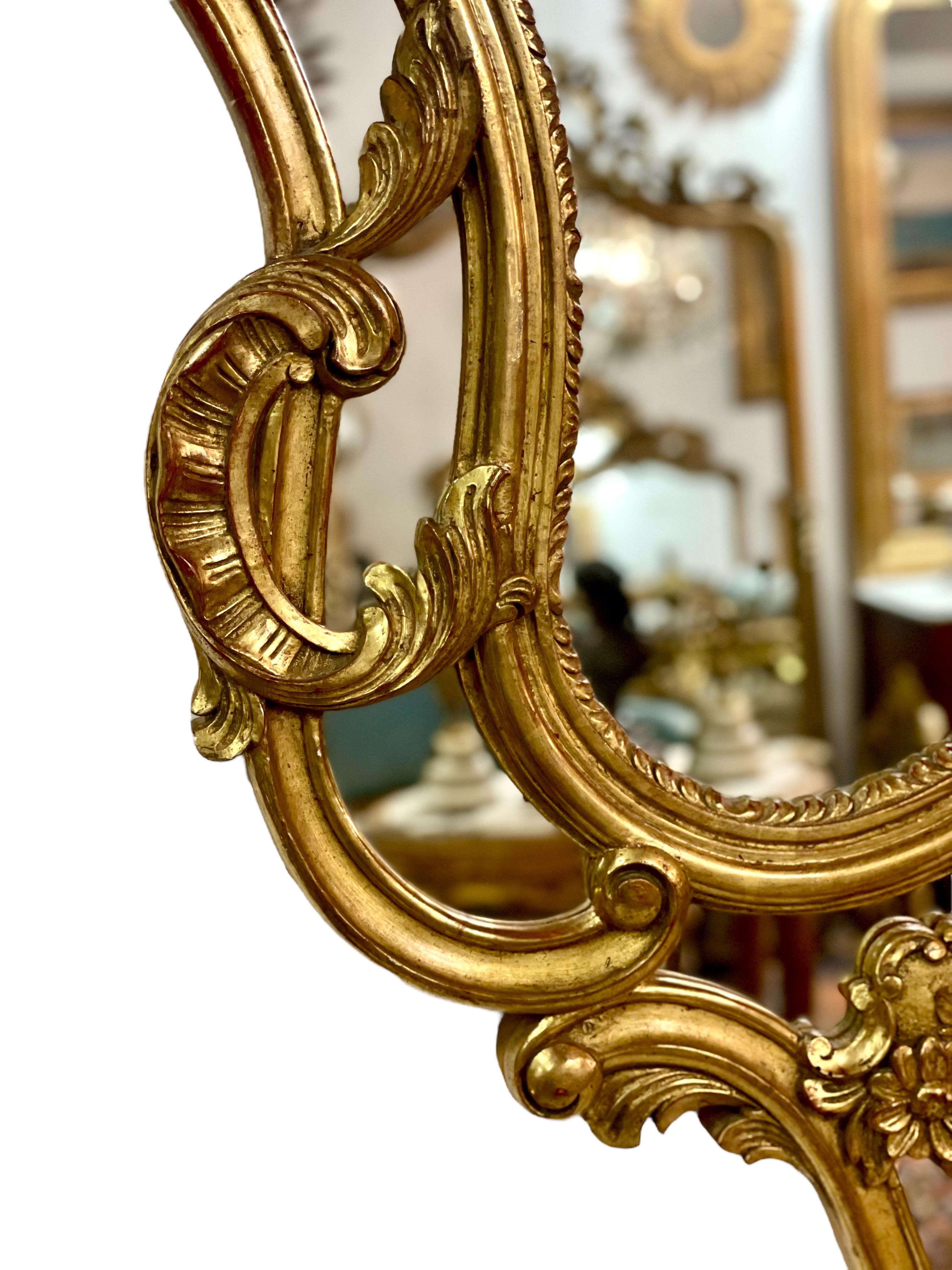 20th Century French Large Rococo Style Gilt Wall Mirror with Parecloses For Sale