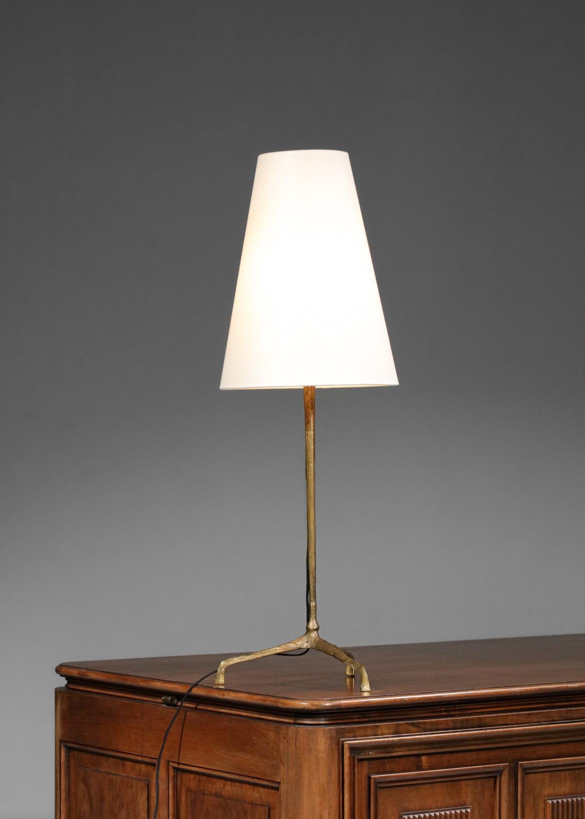 Rare table lamp designer and sculptor Felix Agostini in gilded bronze from the 50s. Solid gilded bronze tripod base, custom made lampshade. Excellent vintage condition, with a superb patina of the bronze. Recommended LED bulb type B22, electrical
