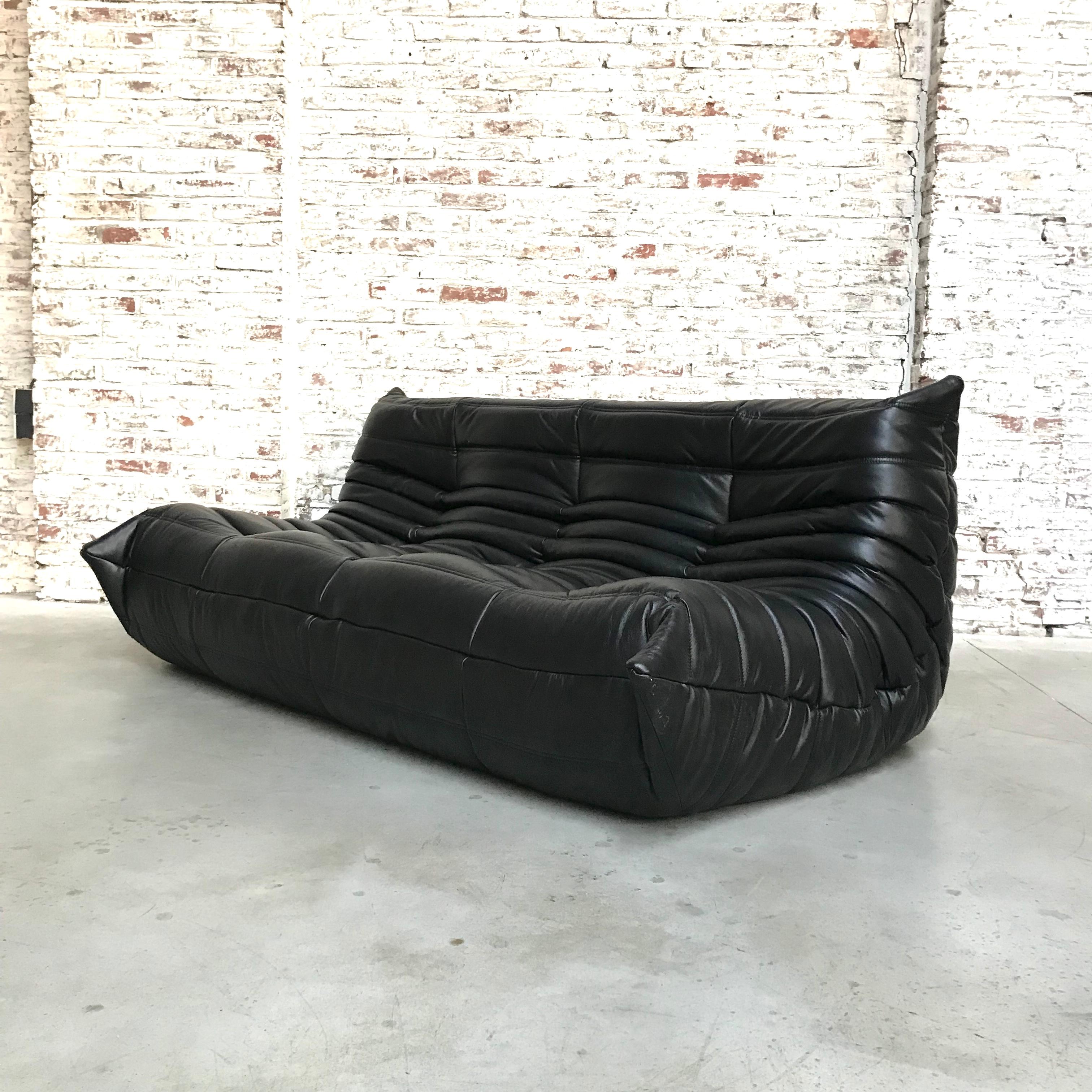 The Togo is designed by Michel Ducaroy in 1973 for Ligne Roset in 1973 but is still very popular today. This Togo is refurbished. Weak parts of foam have been replaced by firm new ones. Thereafter the sofa is reuphostered in fine Italian black