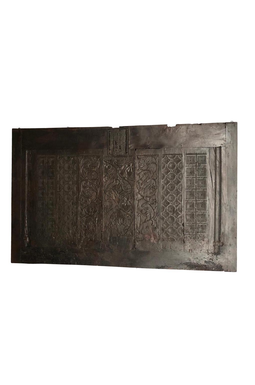 A stunning, early 17th century trunk facade of grand scale. Dated 1621. Soundly constructed from richly stained oak with beautiful carvings of grapes on the vine, birds and other decorative motifs. A wonderful architectural element to be built in or