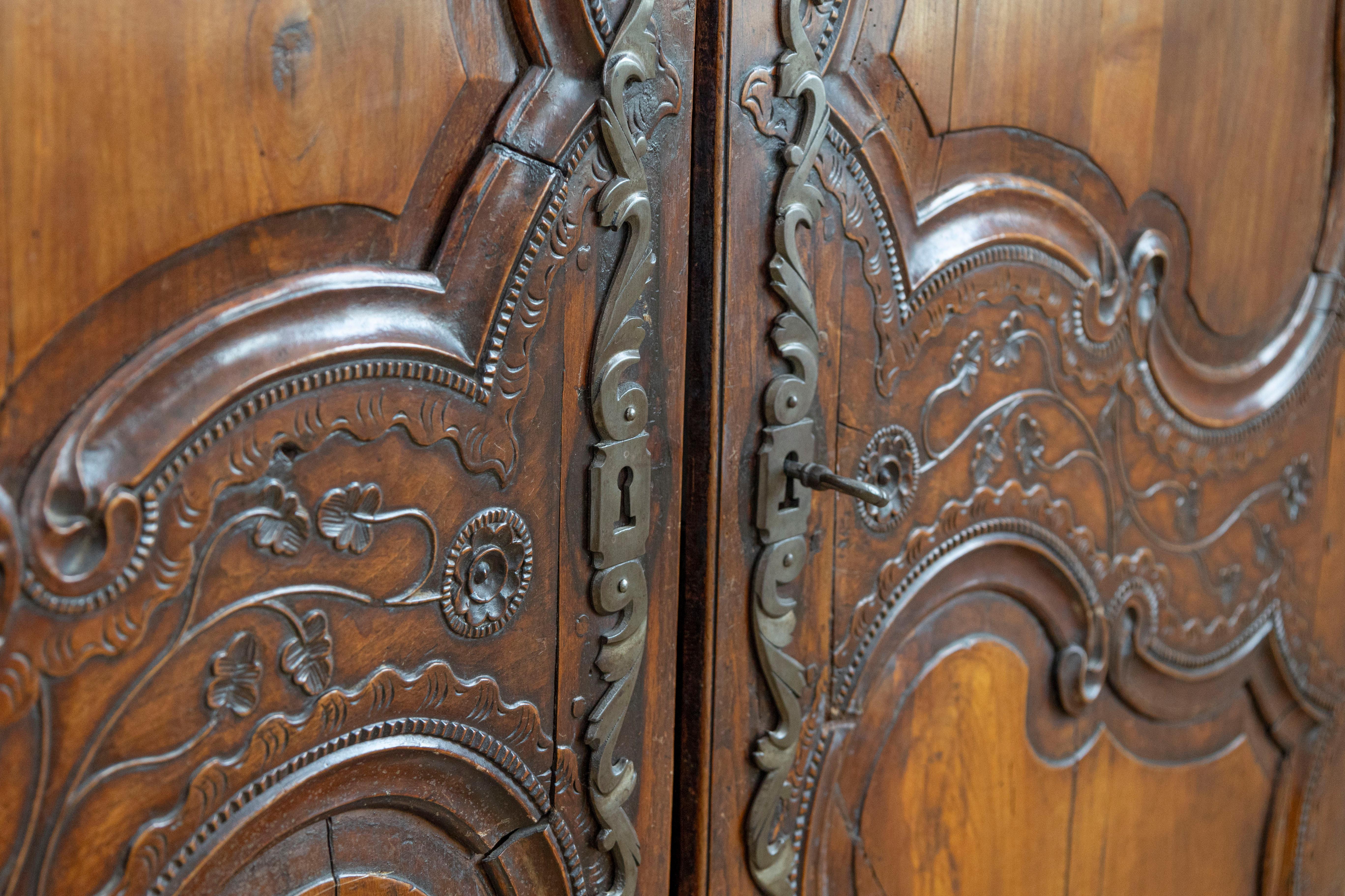 French Late 18th Century Cherry Armoire from Rennes with Hand Carved Décor 5