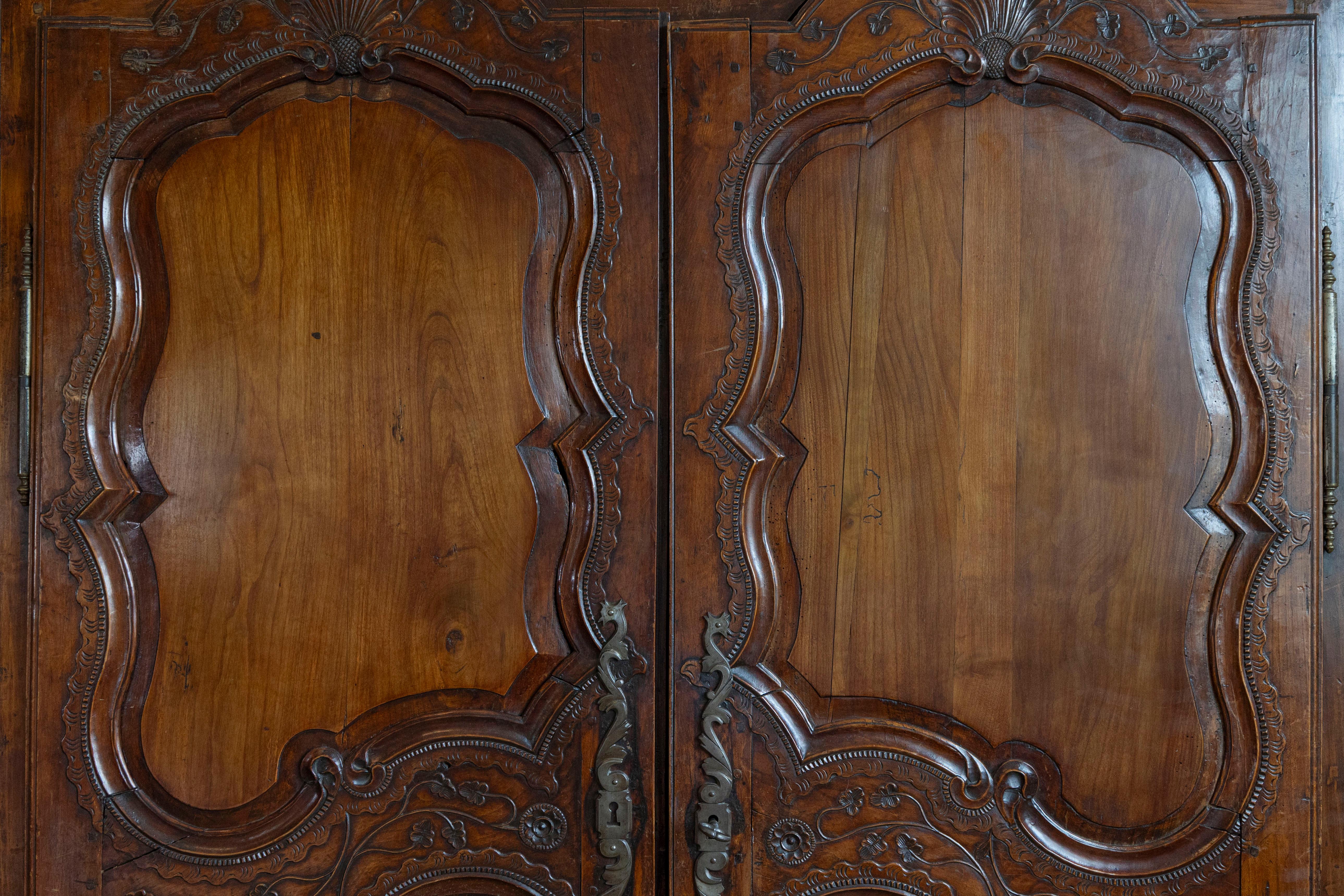 French Late 18th Century Cherry Armoire from Rennes with Hand Carved Décor 7