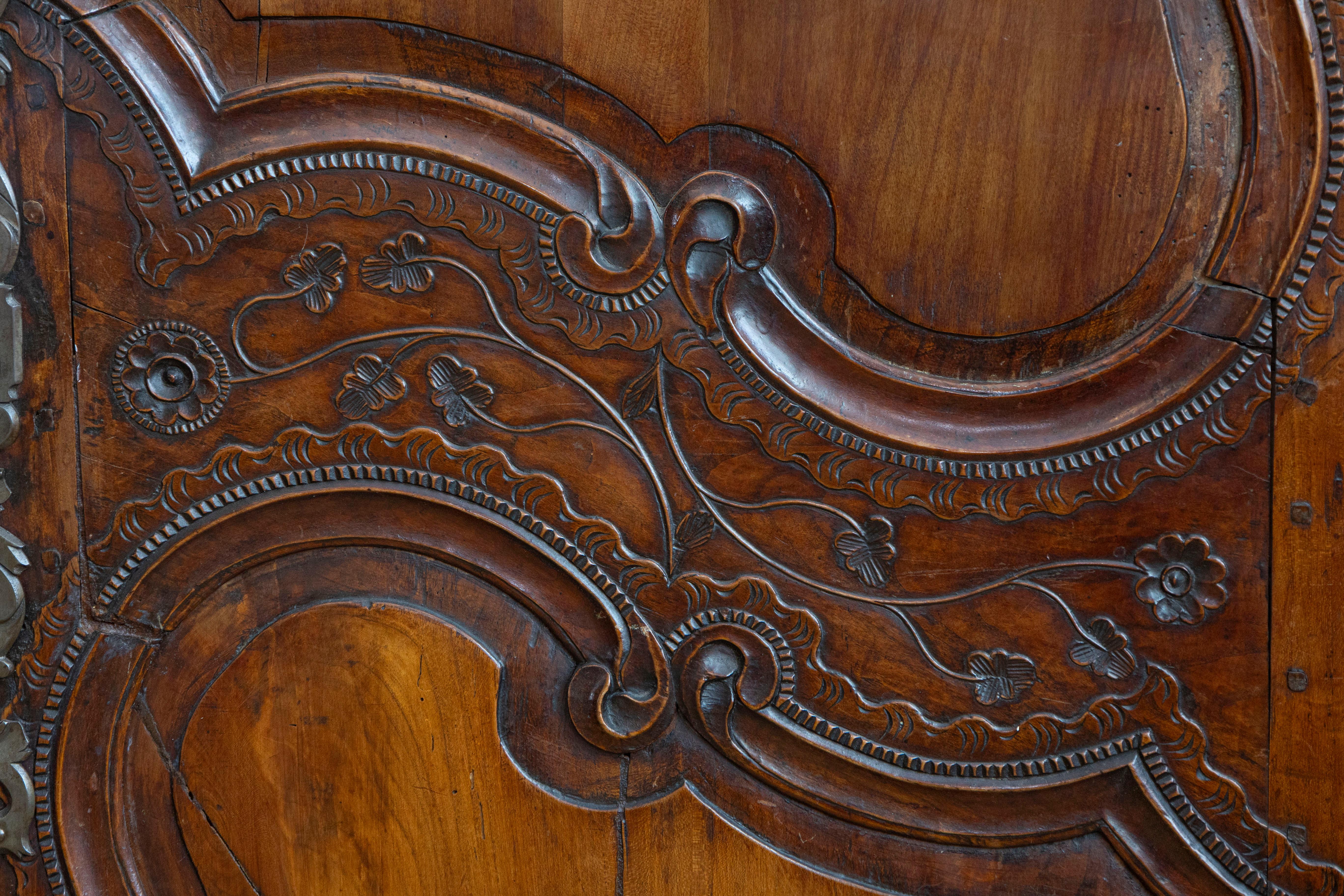 French Late 18th Century Cherry Armoire from Rennes with Hand Carved Décor 1
