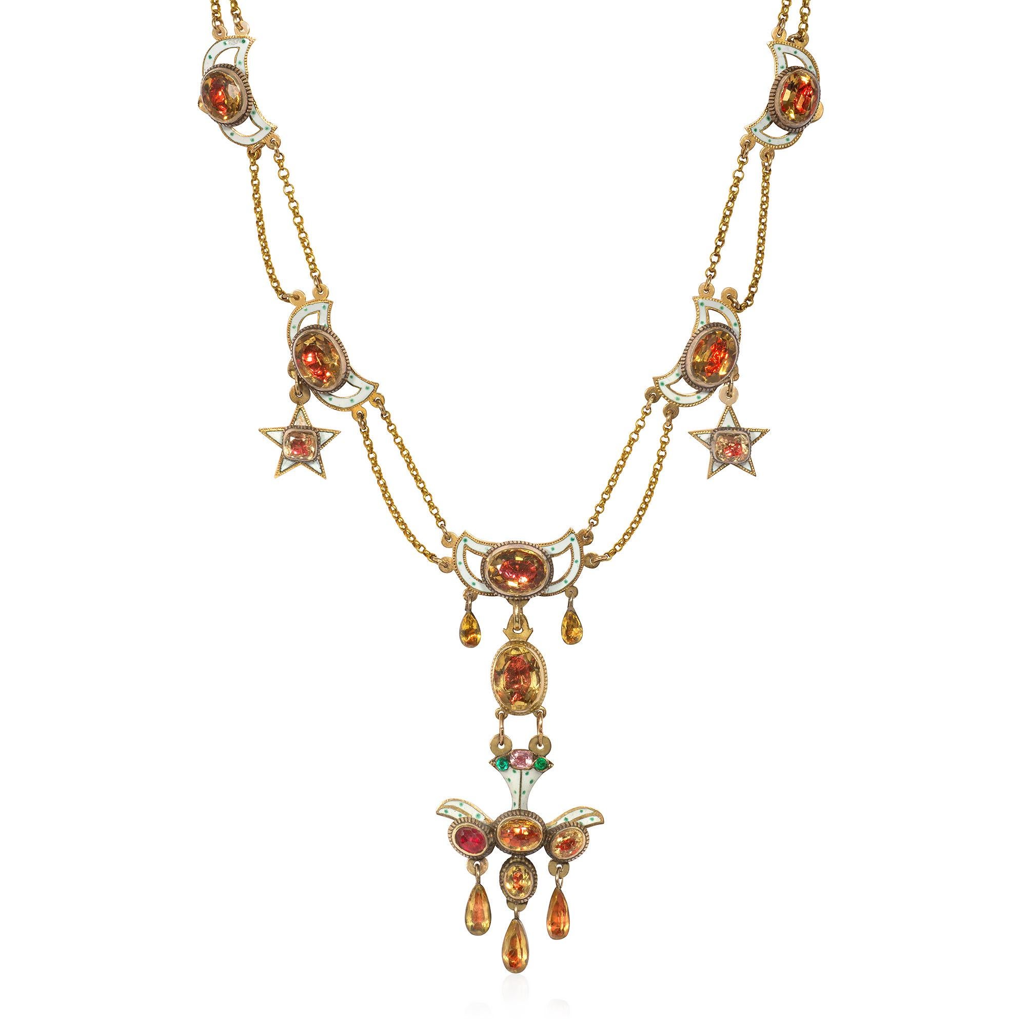 An antique Georgian period gold and foiled citrine festoon necklace comprised of seven winged ornaments with white and green dotted enamel and two star pendants, culminating in a stylized bird pendant set with emeralds and a tourmaline, in 18k. 