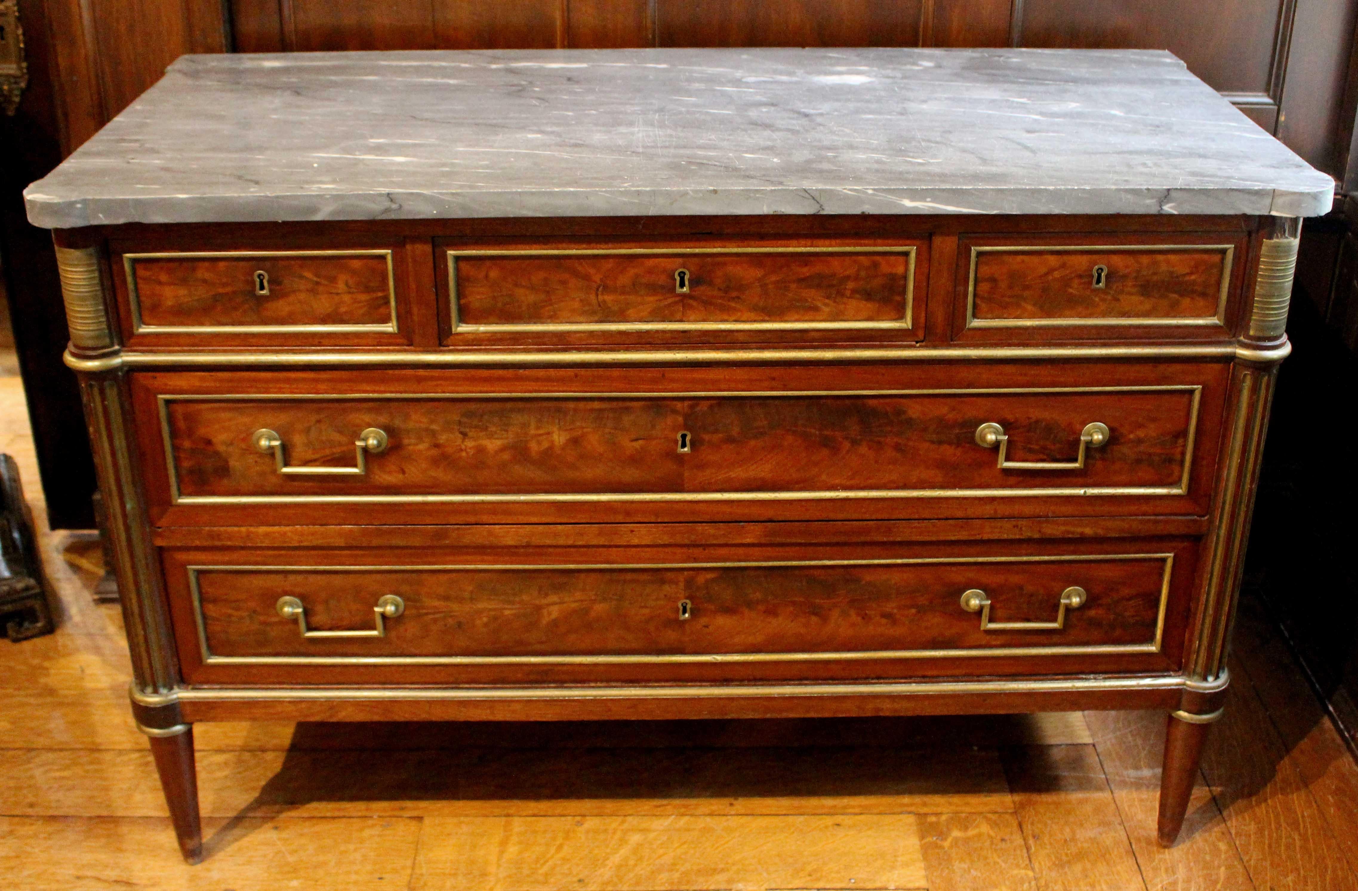 Late 18th century Louis XVI commode, French. Rare blue marble top cut with rounded front corners and outset back to follow the lines of the piece. 3 short over 2 long drawers. Each drawer & side panel with bronze moldings. Bronze mounts in the