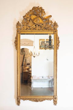 French Late 18th Century Louis XVI Period Giltwood Mirror with Carved Crest