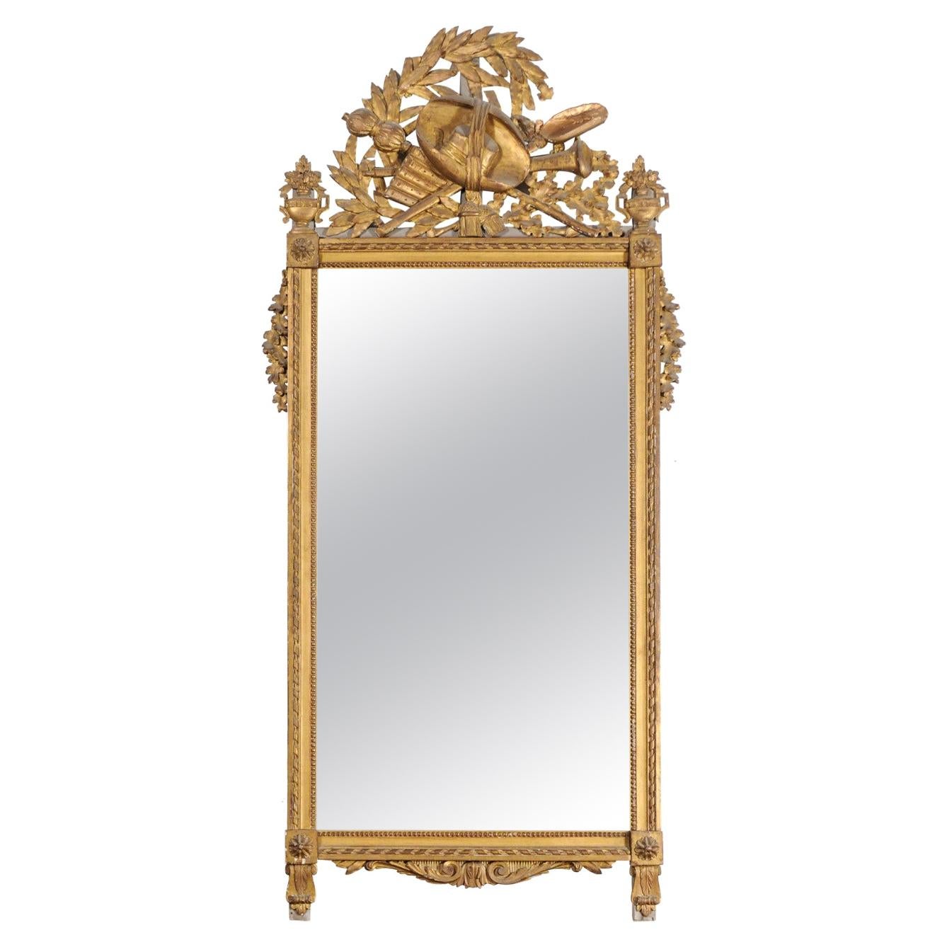 French Late 18th Century Louis XVI Period Giltwood Mirror with Carved Crest For Sale