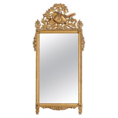 French Late 18th Century Louis XVI Period Giltwood Mirror with Carved Crest