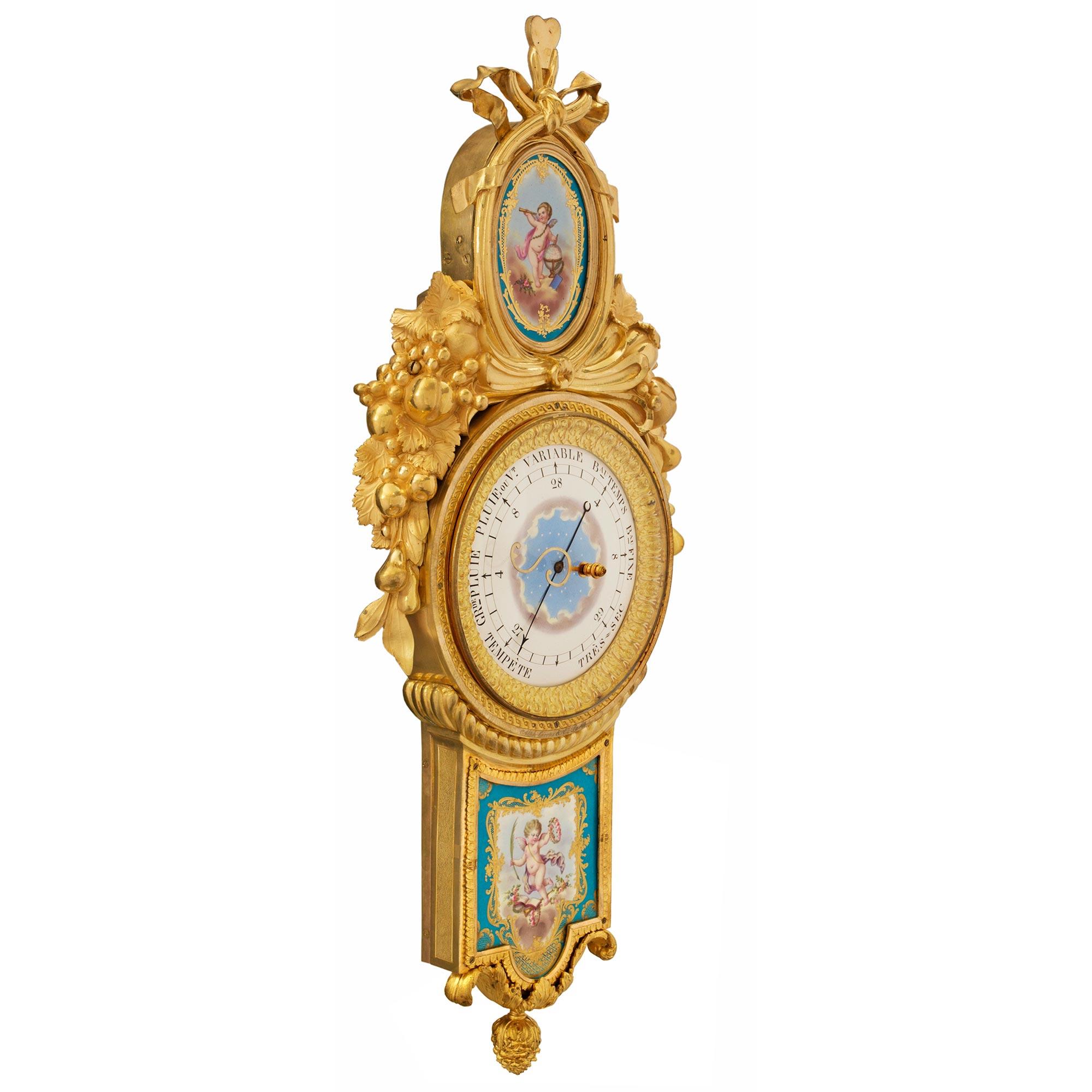 An most elegant and extremely high quality French late 18th/ beginning of the 19th century, ormolu and Sèvres porcelain barometer, signed Giroux. The barometer has a central bottom acorn finial flanked by two 'S' scrolled acanthus leaves. A fitted