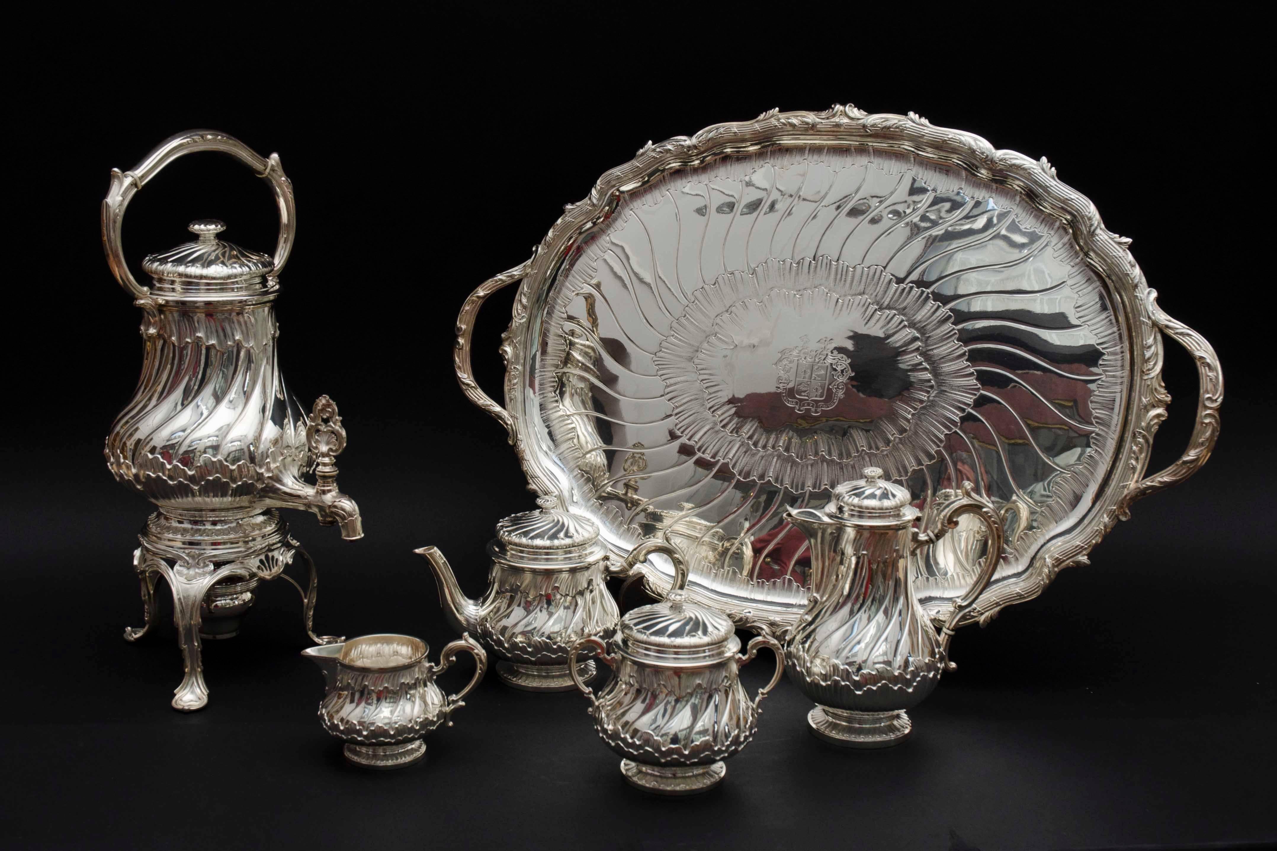 Rare complete tea and coffee sterling silver set with a teapot, coffeepot, milk jug, sugar bowl, a kettle with Stand and lamp and large tray. All marked with the stamp 