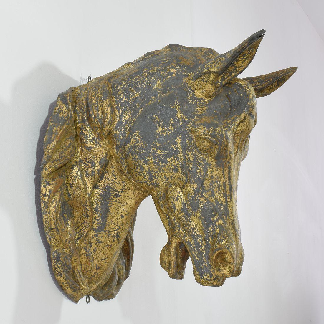 A beautiful French gilt zinc decorative horse head from the late 19th century with great details on the mane and musculature.
France, circa 1880-1900. Beautiful weathered and small losses. More pictures available on request.