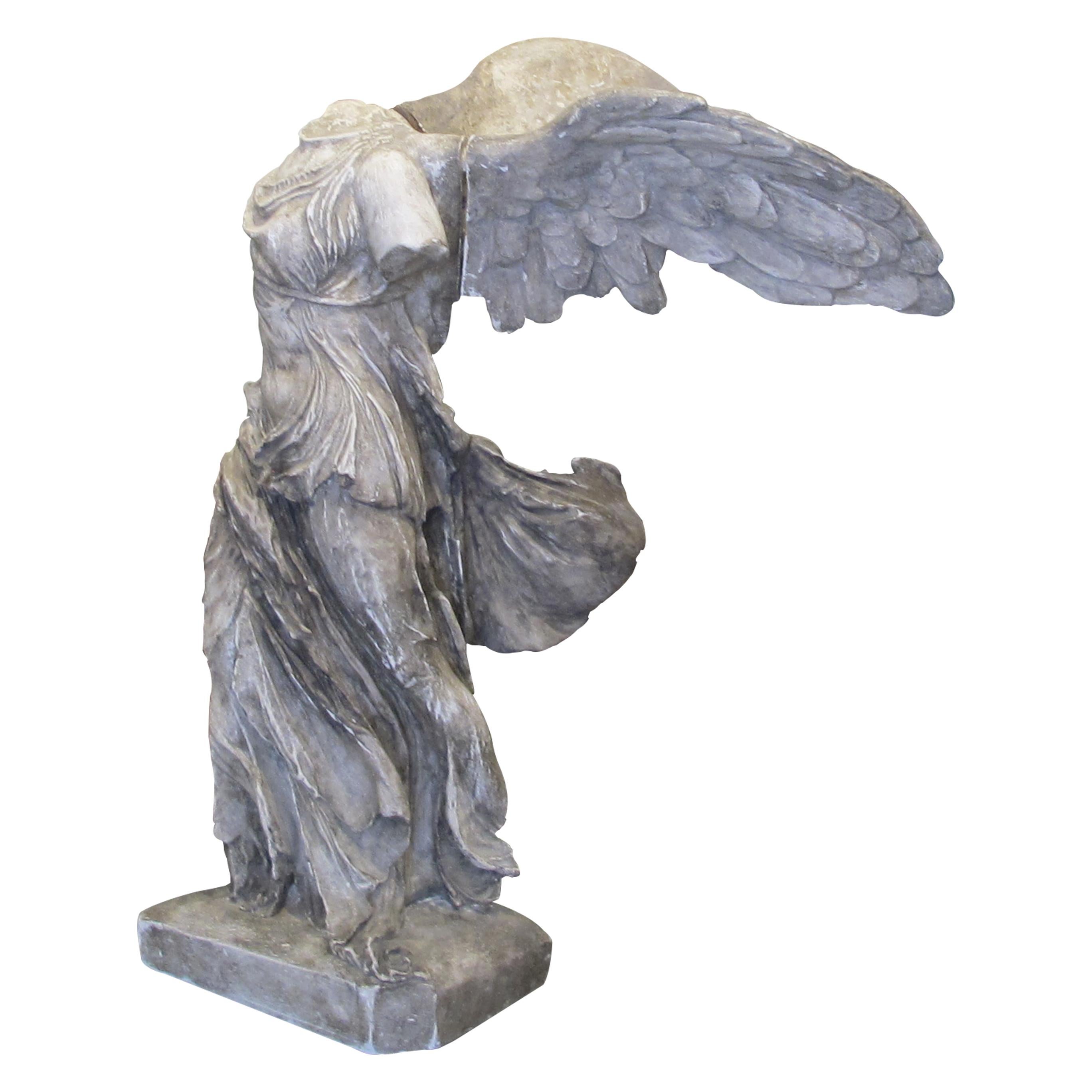 Highly decorative late 19th Century Nike plaster statue goddess of victory known as “Nike (Winged Victory) of Samothrace”. This late reproduction based on the original statue currently at the Louvre Museum in Paris has two removable wings held in by