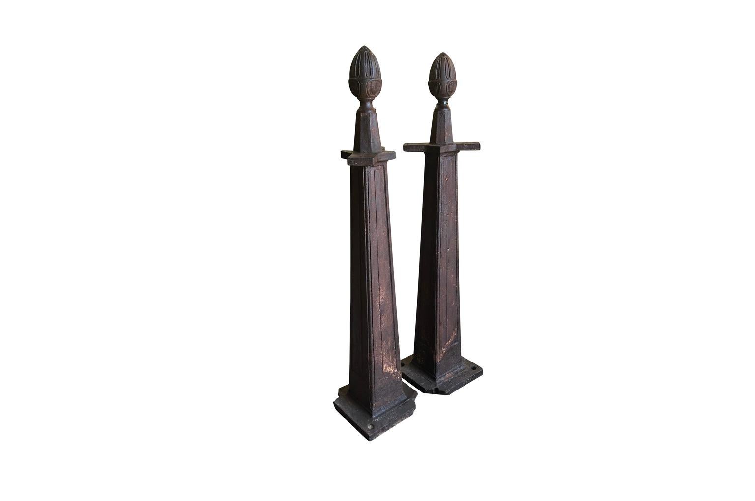 A very handsome pair of late 19th century gate supports in cast iron. Wonderful architectural elements for any interior or exterior.