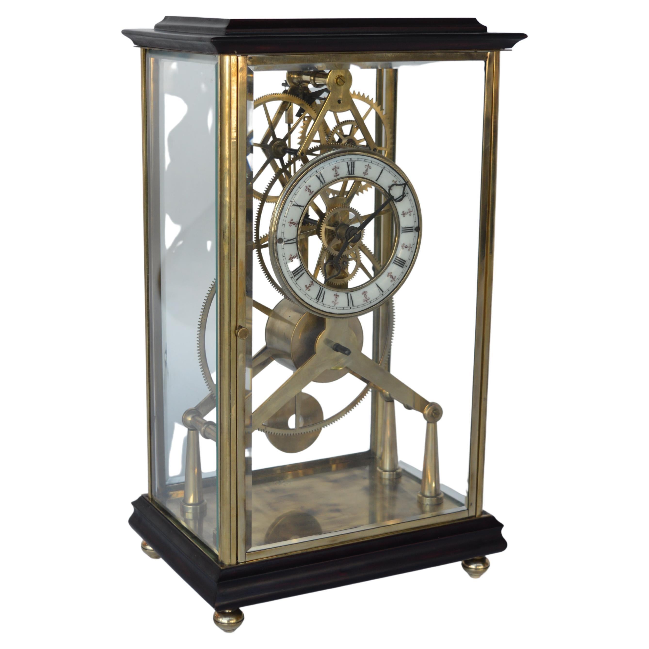 Stamped, French late 19th century skeleton clock. Made out of Mahogany wood and brass. Porcelain dial with roman numeral details.