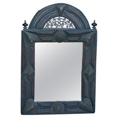 French Late 19th Century Tramp Art Ebonized Mirror with Carved Arching Crest