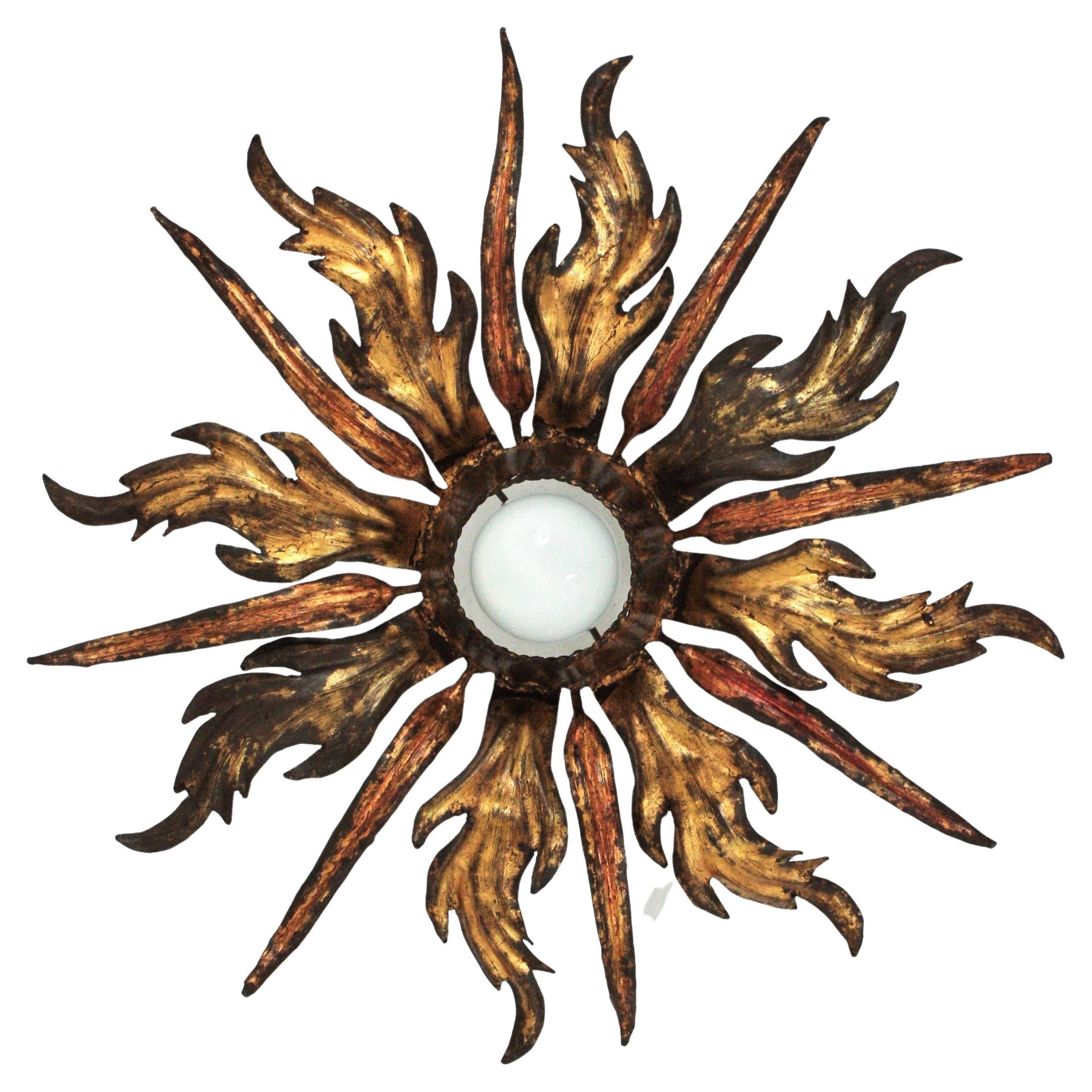 French Leafed Copper 
Gilt Iron Sunburst Ceiling Light Fixture, 1940s