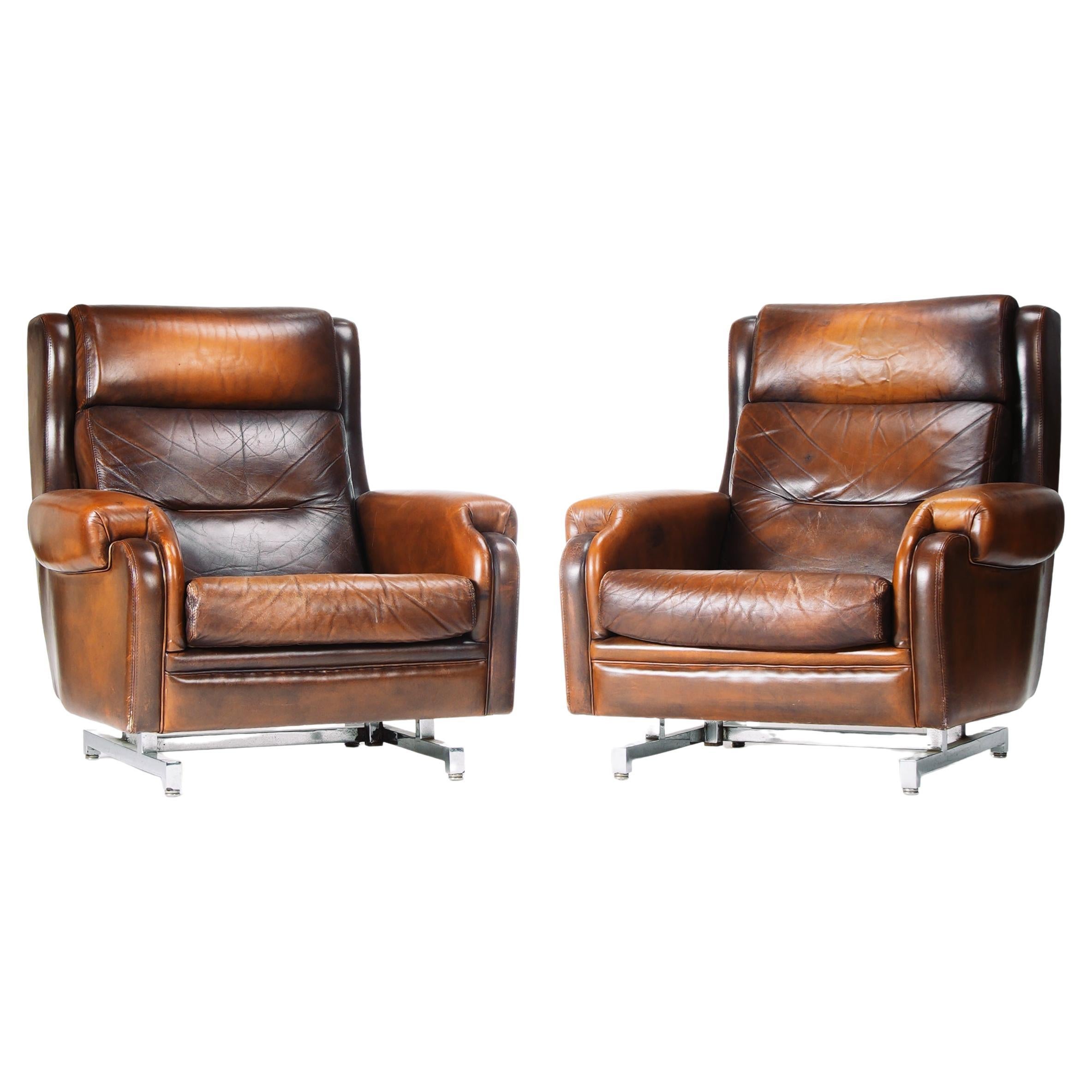 Poltrone reclinabili in pelle francese e cromo - Due disponibili